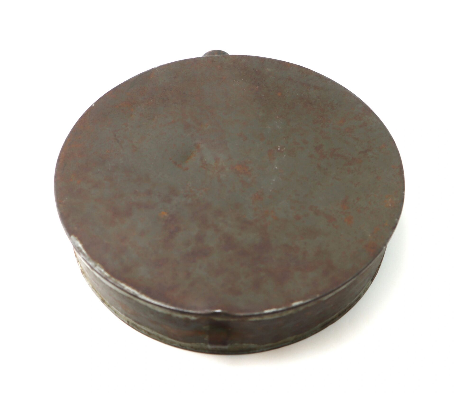A Civil War Tin Drum Canteen, round and flat with a rusty, weathered metal surface, displayed against a plain white background.