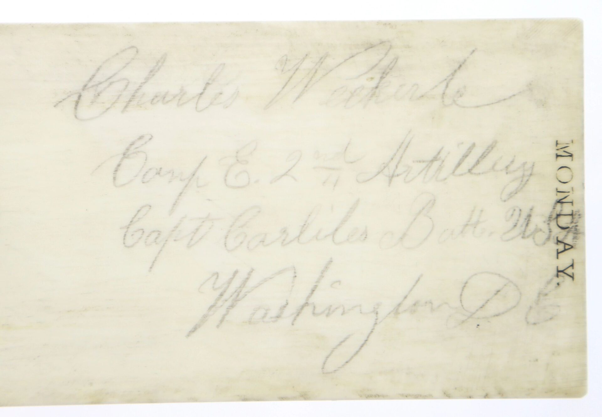 Faded handwritten note: "Charles Weckerle, Battery E, 2nd U.S. Light Artillery, Washington D.C." on an Ivory Day Planner, with "MONDAY" printed vertically on the side.