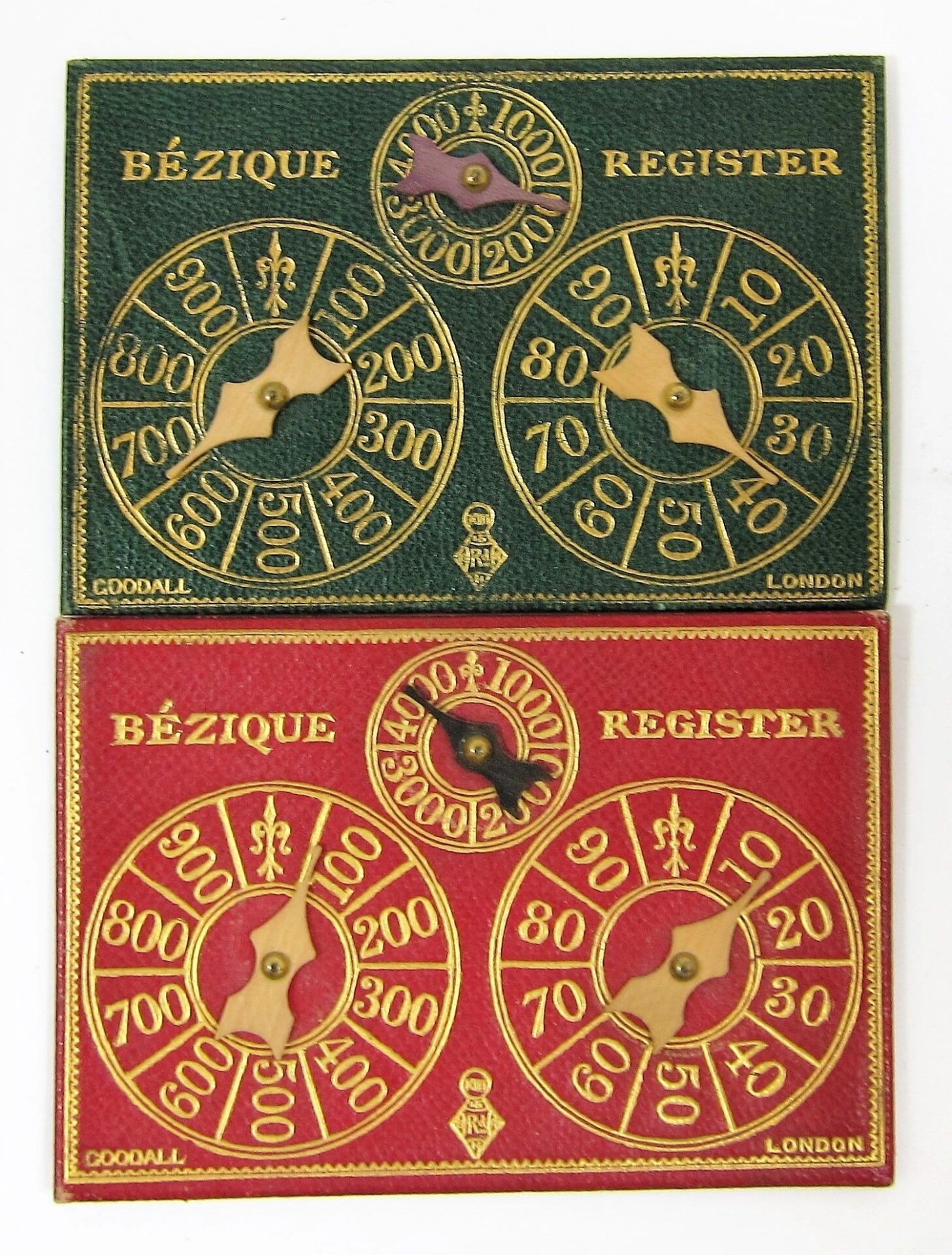Two vintage Bezique Card Game scorecards, one green and one red, feature gold numbering and two rotating pointers each to track scores from 0 to 1000.