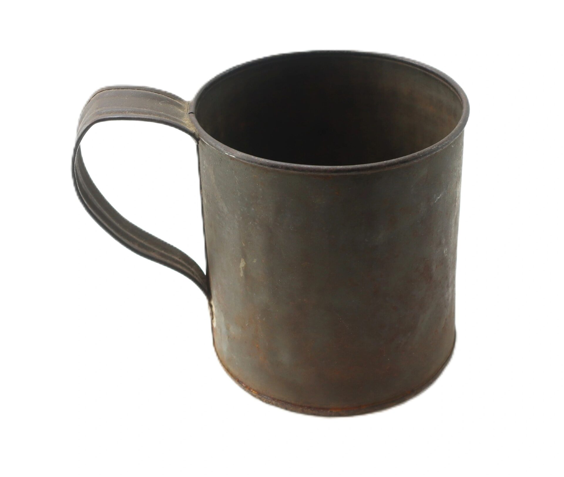The Civil War Tin Cup is a weathered metal mug with a handle, displaying signs of rust and age, shown on a white background.