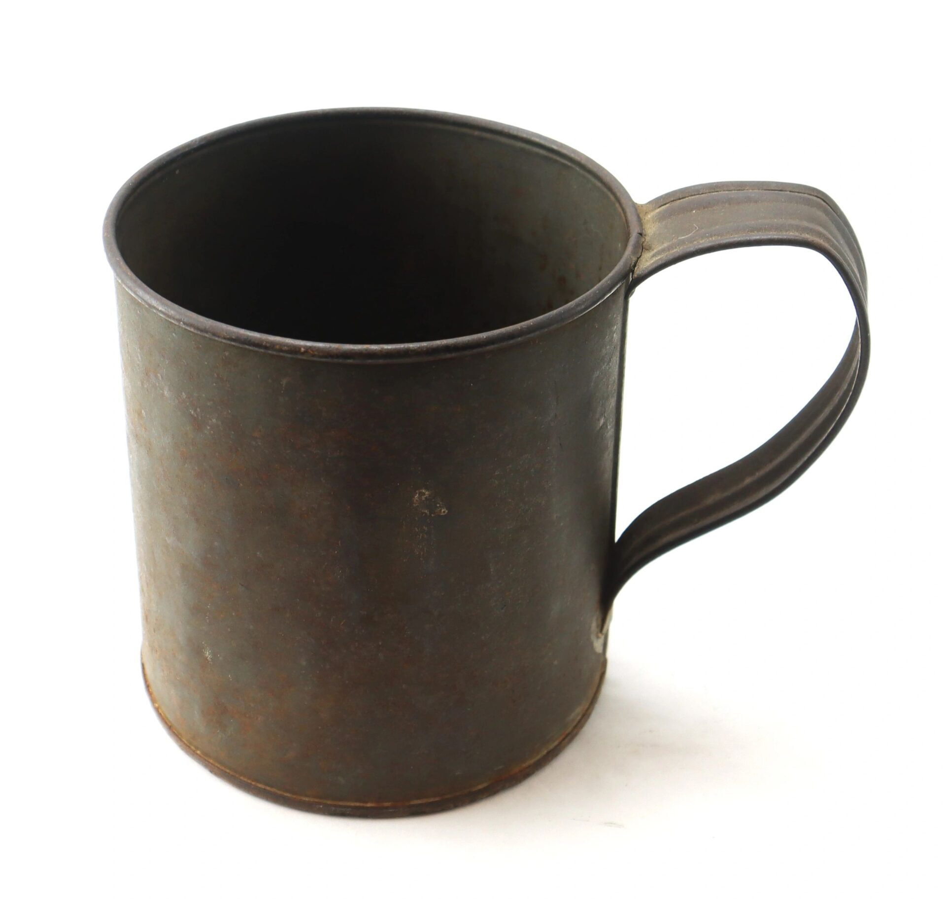 A Civil War Tin Cup with a handle, featuring a rustic, weathered metal finish and visible signs of age, is shown on a white background.