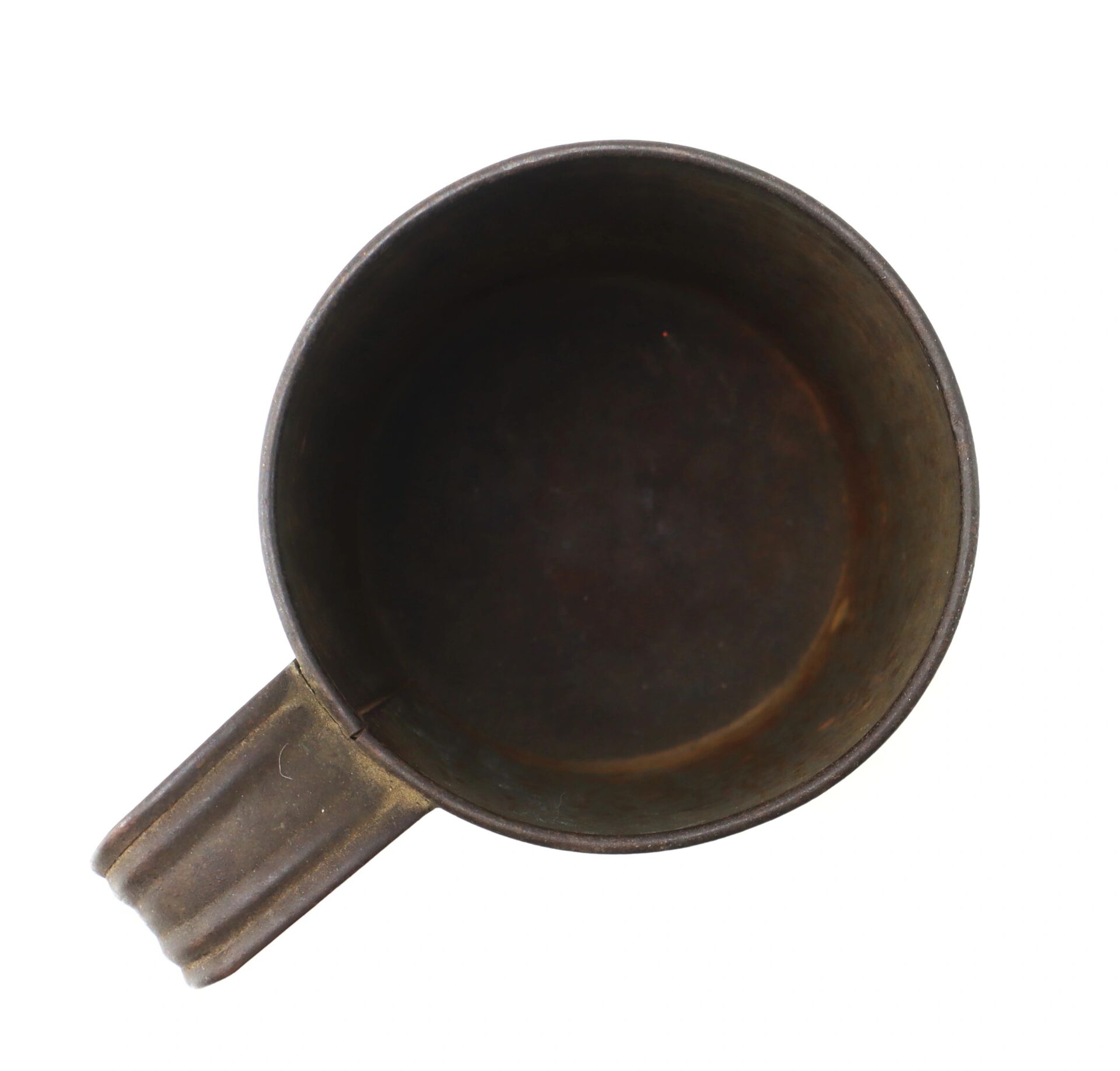 Top view of an empty Civil War Tin Cup, made of dark metal with a handle, isolated on a white background.