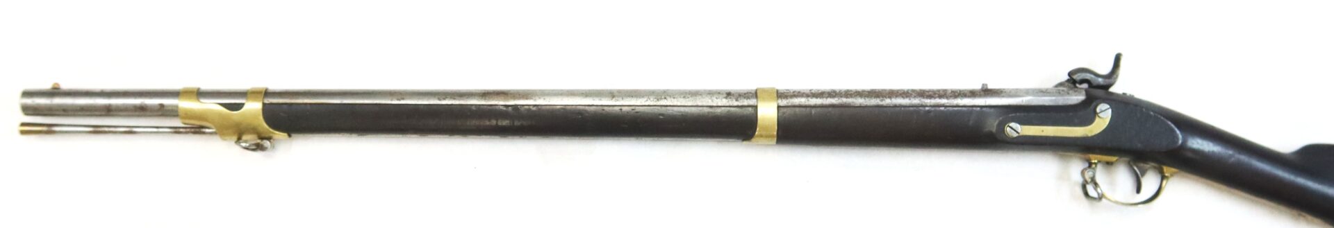 A vintage percussion cap rifle with a wooden stock, metal barrel, and brass fittings, displayed on a white background.