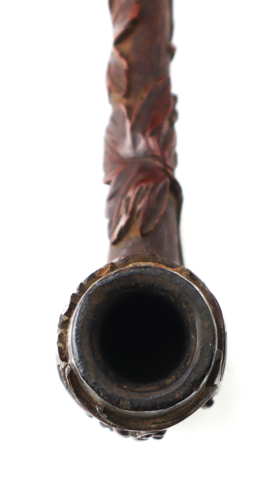 A close-up, top-down view of the mouthpiece of the Hand-Carved Civil War-Era Pipe with Grape Leaf Motif against a white background.