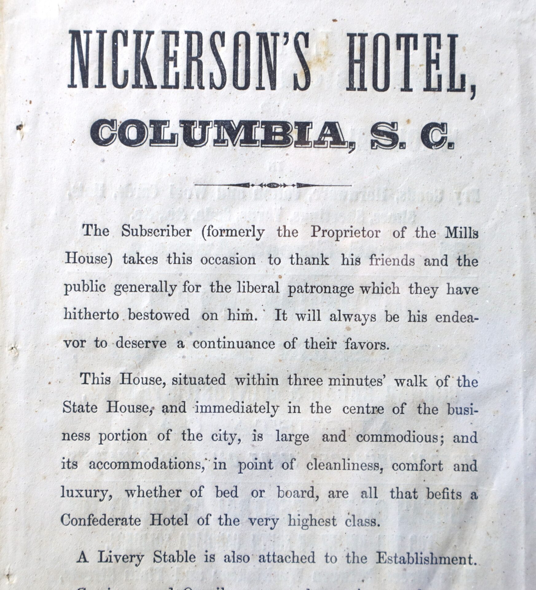 Old advertisement for Nickerson's Hotel in Columbia, S.C., describing its location, amenities, and appeal to upper-class guests, with a note about an attached livery stable.