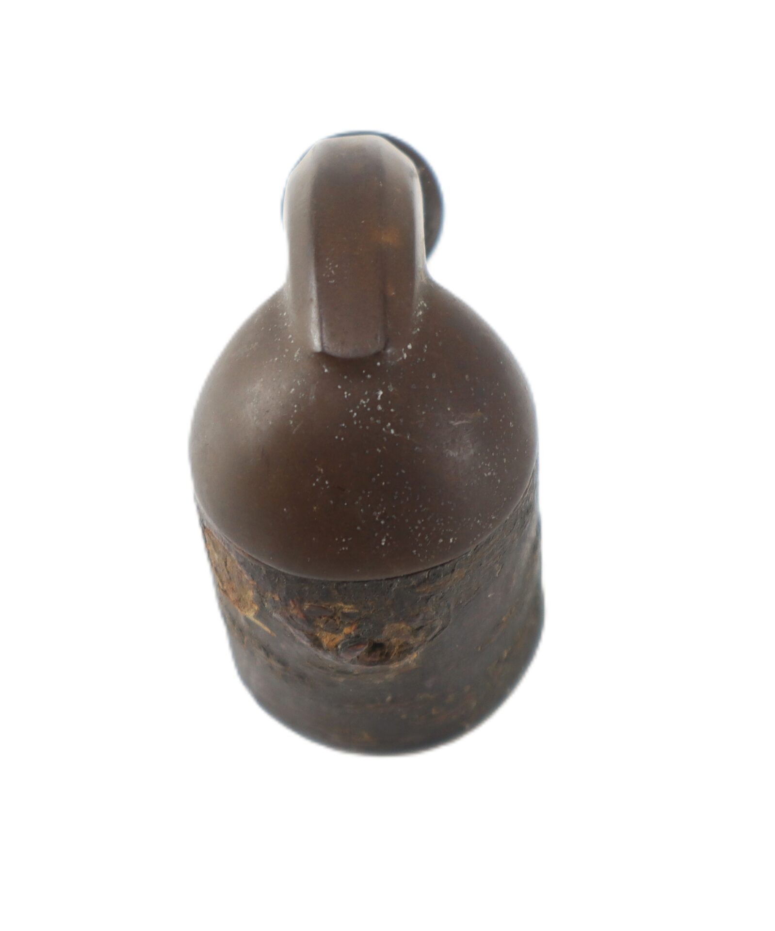 A Civil War Era Gutta Percha and Wood Pipe Bowl with a dark brown, cylindrical shape, rounded top, and narrow neck, showing residue near the base, is photographed on a white background.