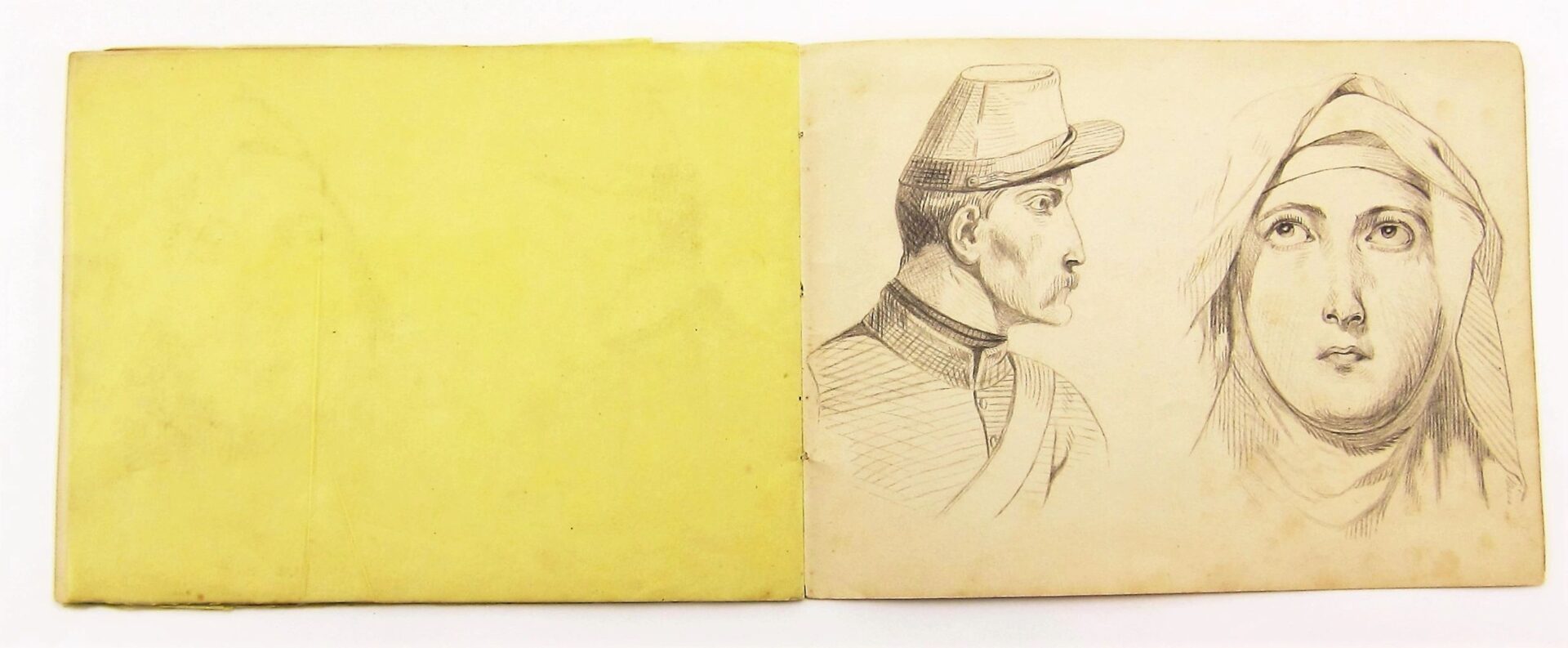 The Original Civil War Era Sketch Book is open, showing pencil drawings of a man in a hat and uniform on one page and a woman in a headscarf on the other, with a blank yellow page visible.