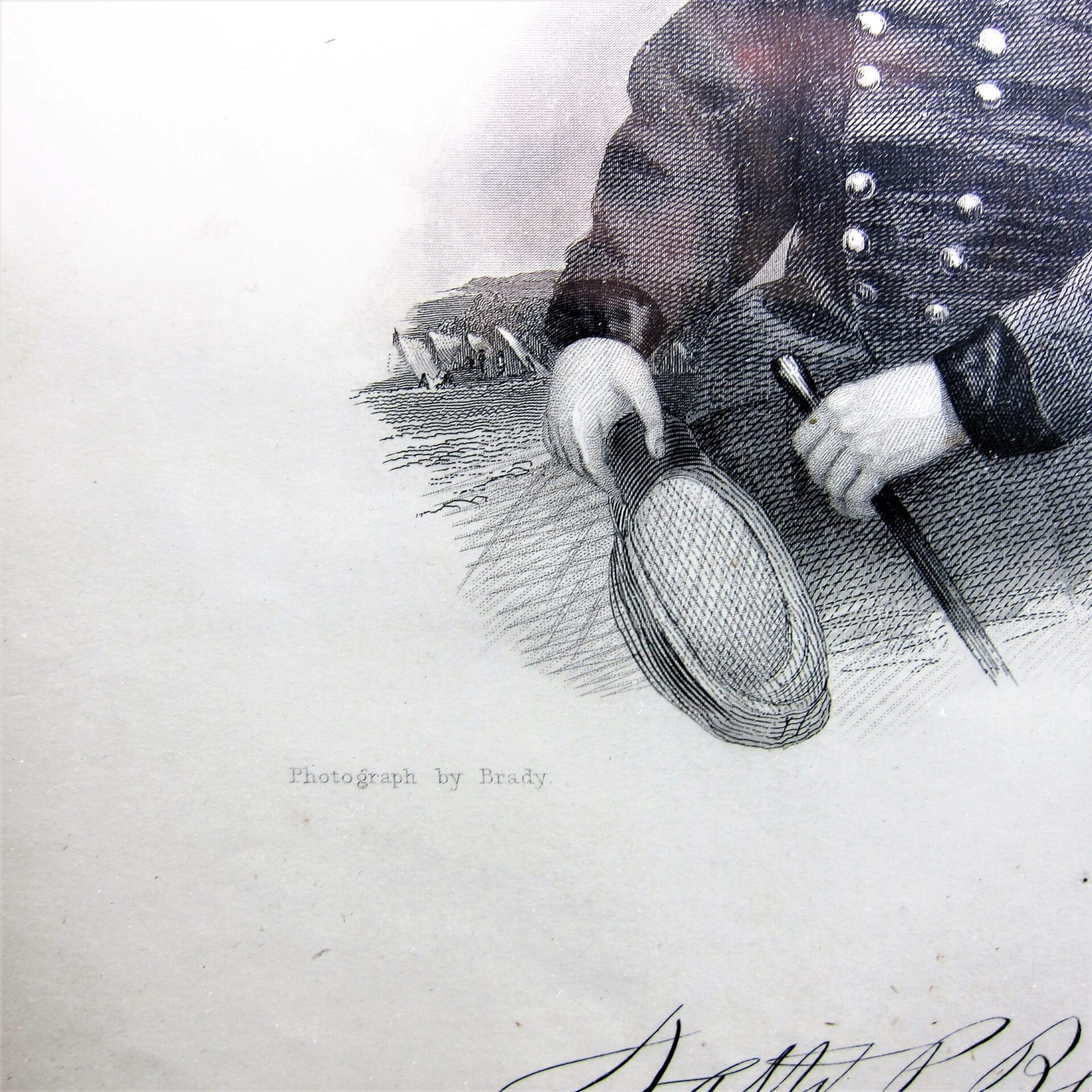 Close-up of the Union General Nathaniel Prentiss Banks Brady Based Engraving, showing a torso in a buttoned uniform holding a hat and cane, with "Photograph by Brady" printed below.