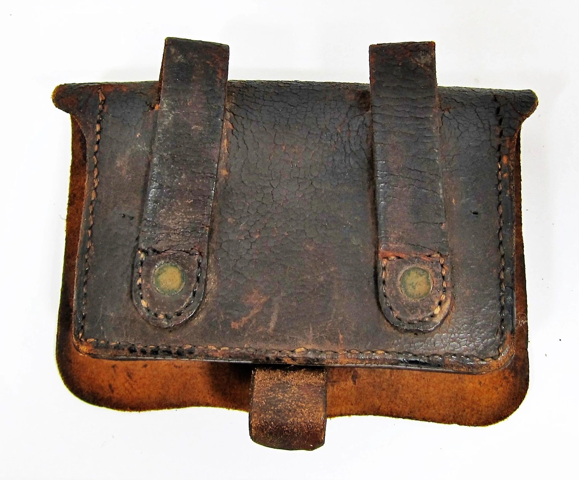 A Civil War Pistol Box, sold, featuring aged brown leather with two belt loops and a flap closure that shows signs of wear and use.