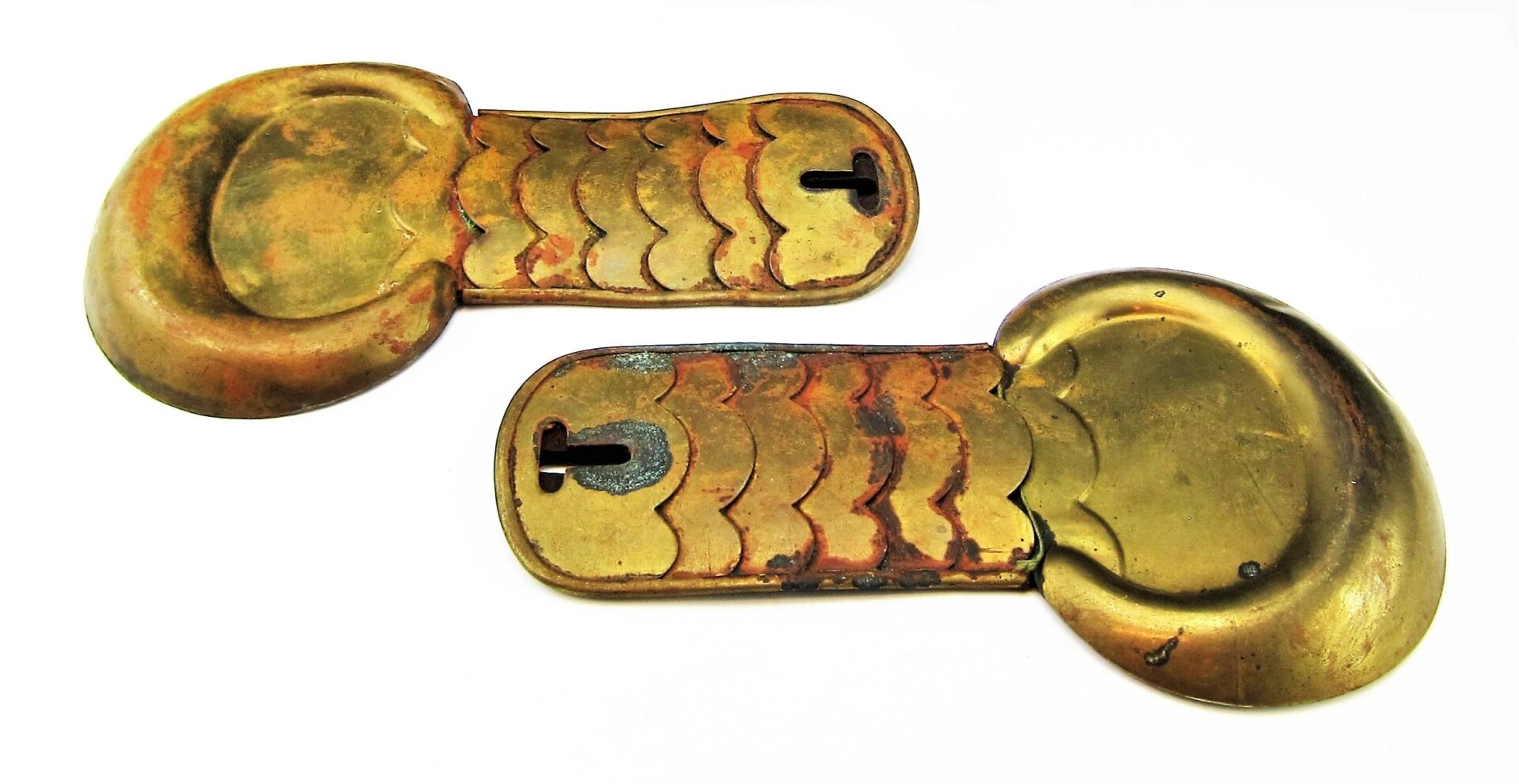 Civil War Shoulder Scales—antique brass armor plates featuring segmented, scale-like designs with keyhole-shaped openings.