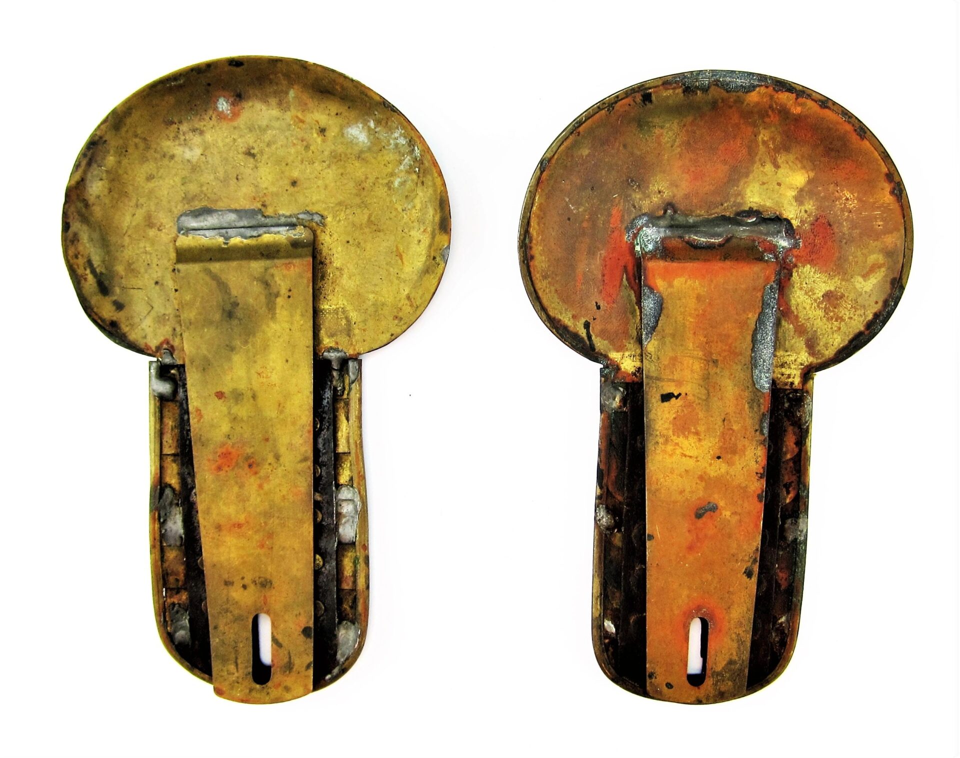 Two tarnished, round Civil War Shoulder Scales with rectangular clips attached are shown from the back on a white background.