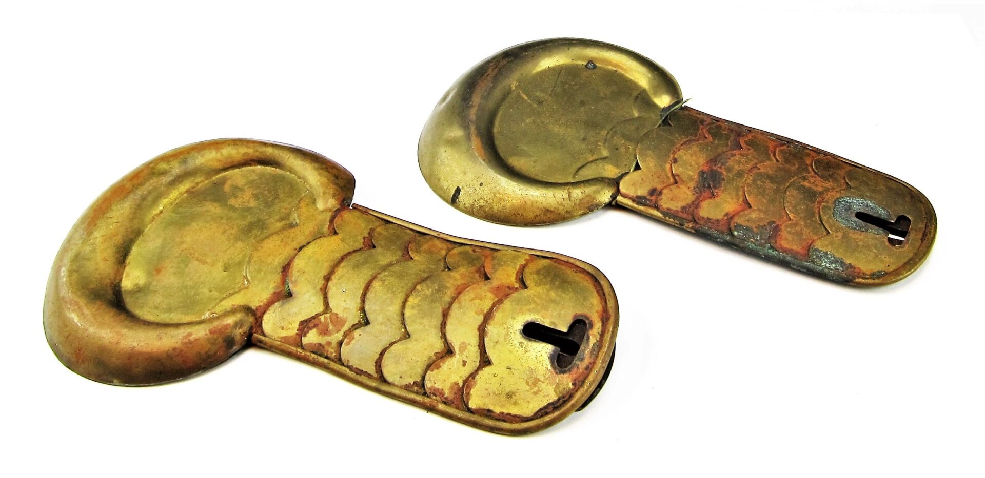 Two Civil War shoulder scales in antique brass, keyhole-shaped and possibly used as traditional armor parts, are displayed on a white background.