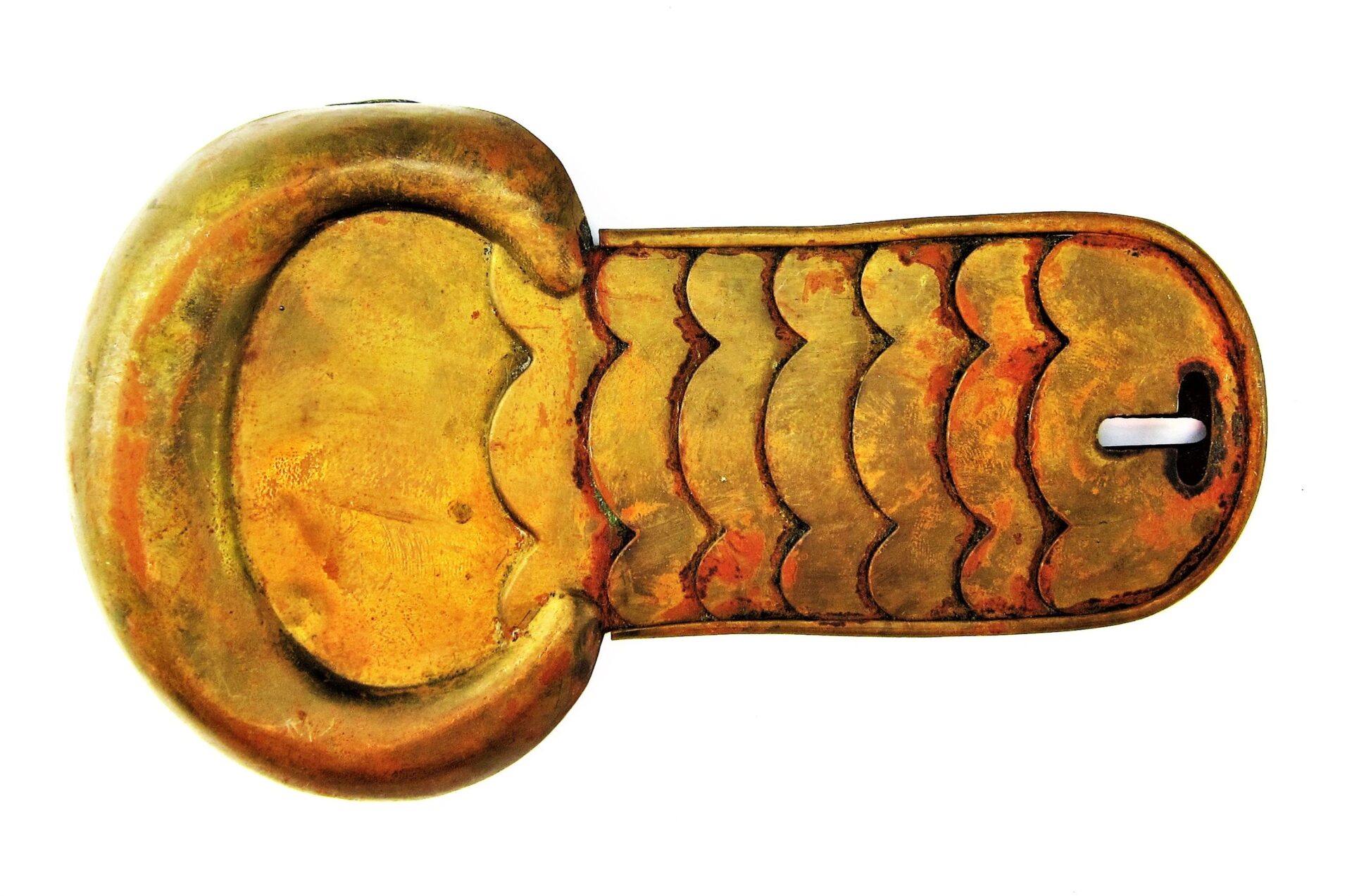 A pair of Civil War Shoulder Scales, gold-colored metal with a rounded end and engraved wavy lines, resembling an ancient decorative artifact.