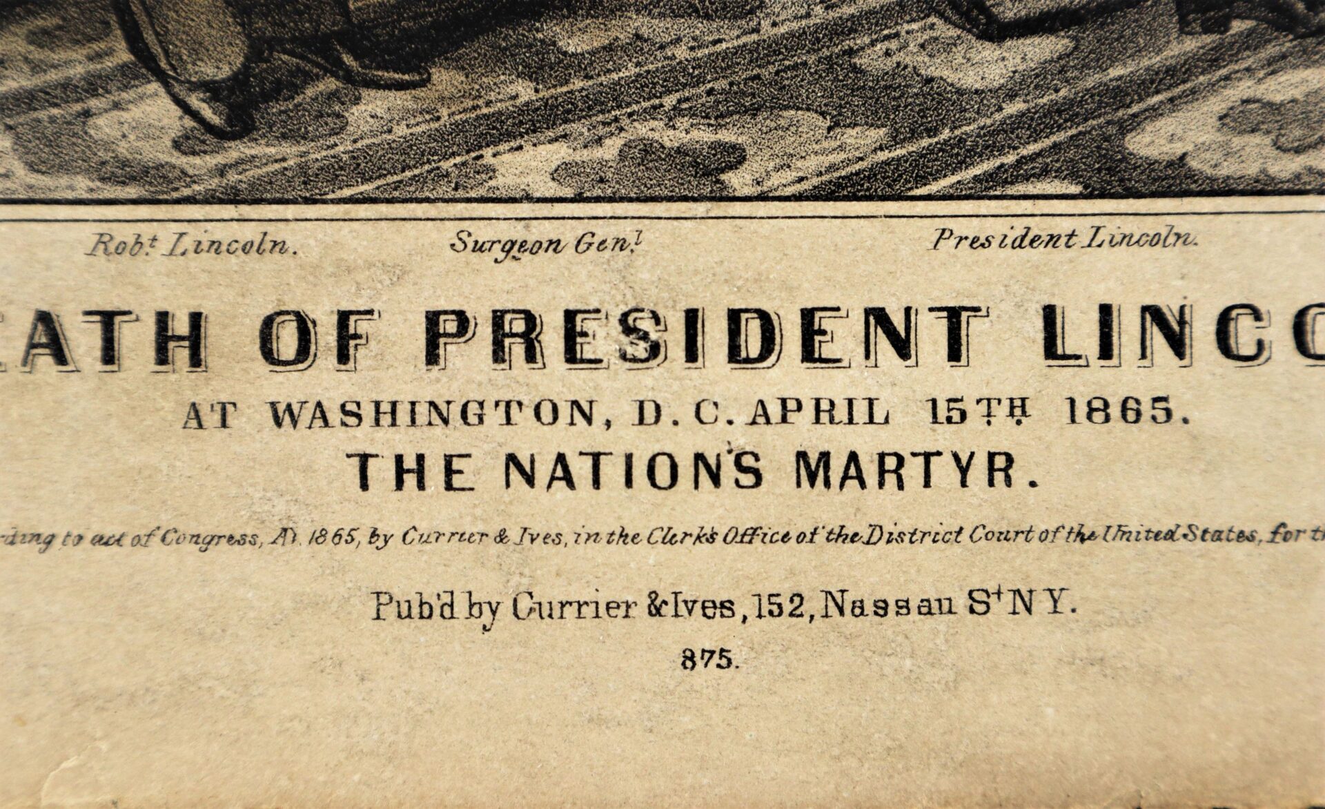 Close-up of an old printed document titled "Death of President Lincoln, The Nations Martyr," announcing Lincoln's death on April 15th, 1865, published by Currier & Ives.