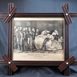 Framed black-and-white illustration titled "Death of President Lincoln, The Nations Martyr," shows Lincoln lying in bed surrounded by mourners, with a woman seated in the foreground.