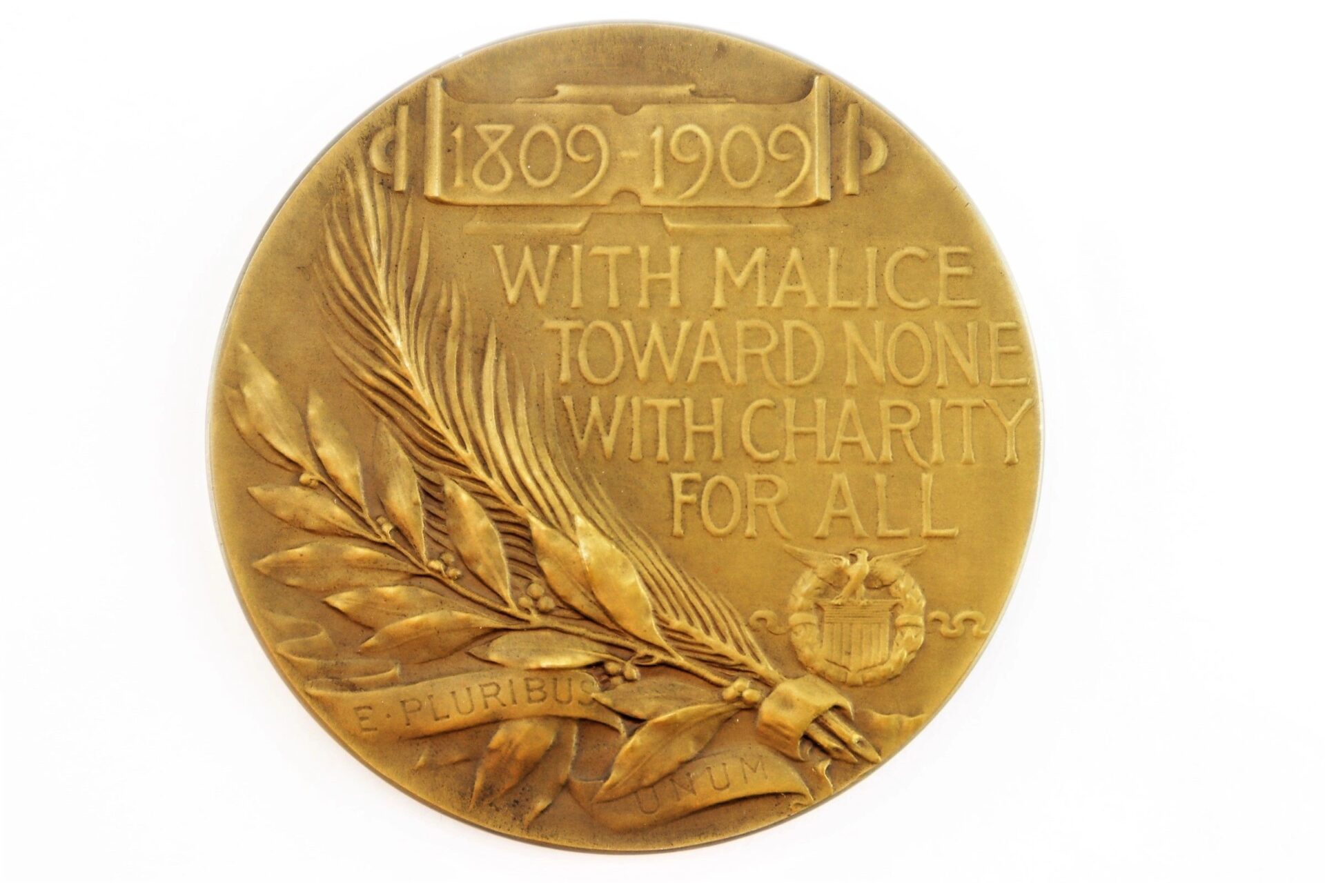 Abraham Lincoln Medallion / SOLD: Bronze medallion inscribed with "1809-1909," "With malice toward none, with charity for all," a laurel branch, palm frond, and a banner reading "E pluribus unum.