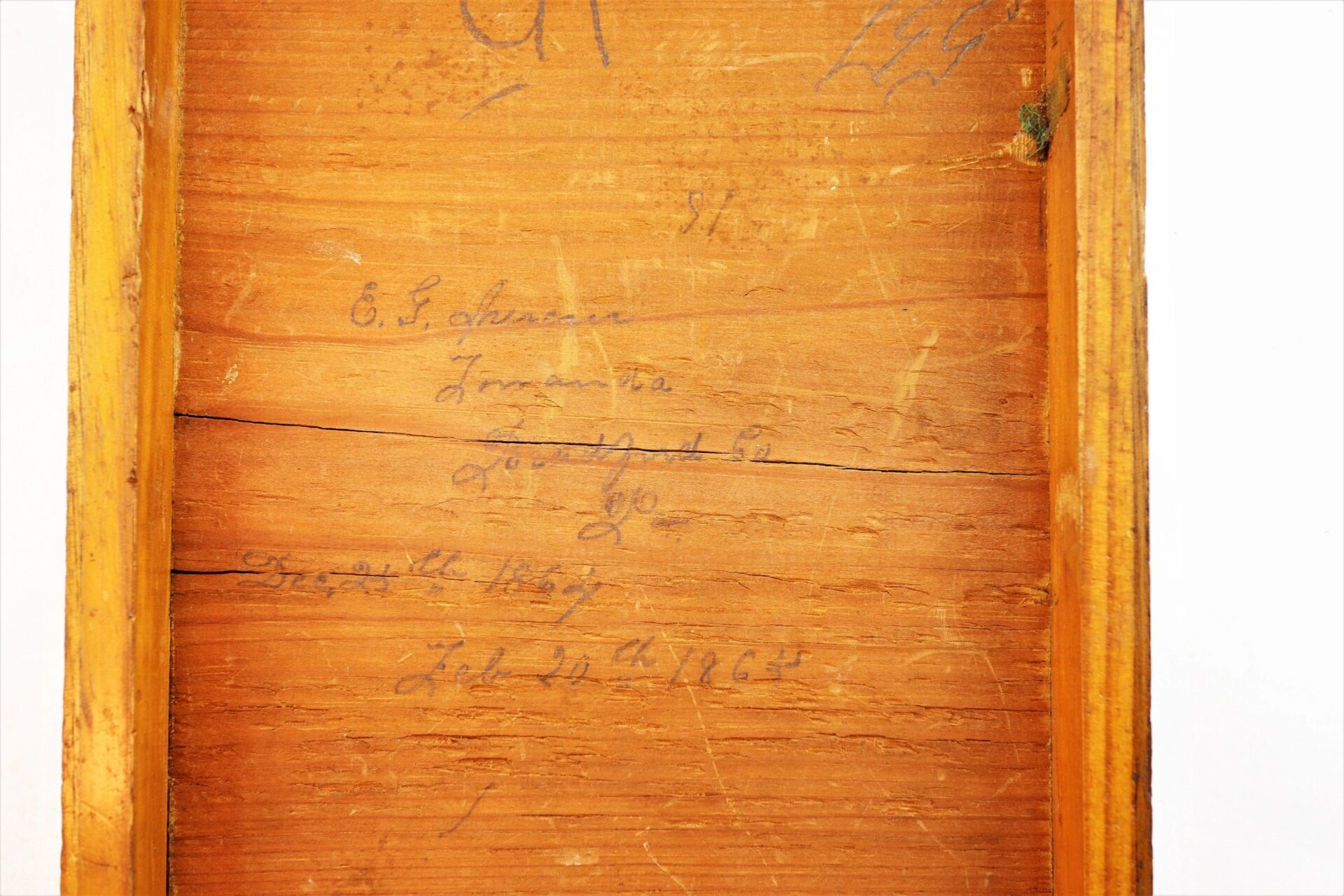 Wooden surface with handwritten pencil text—names, numbers, and faded words—in a rectangular frame; part of the Personal Effects of Civil War Surgeon Dr. Seth L. Sprague / SOLD.
