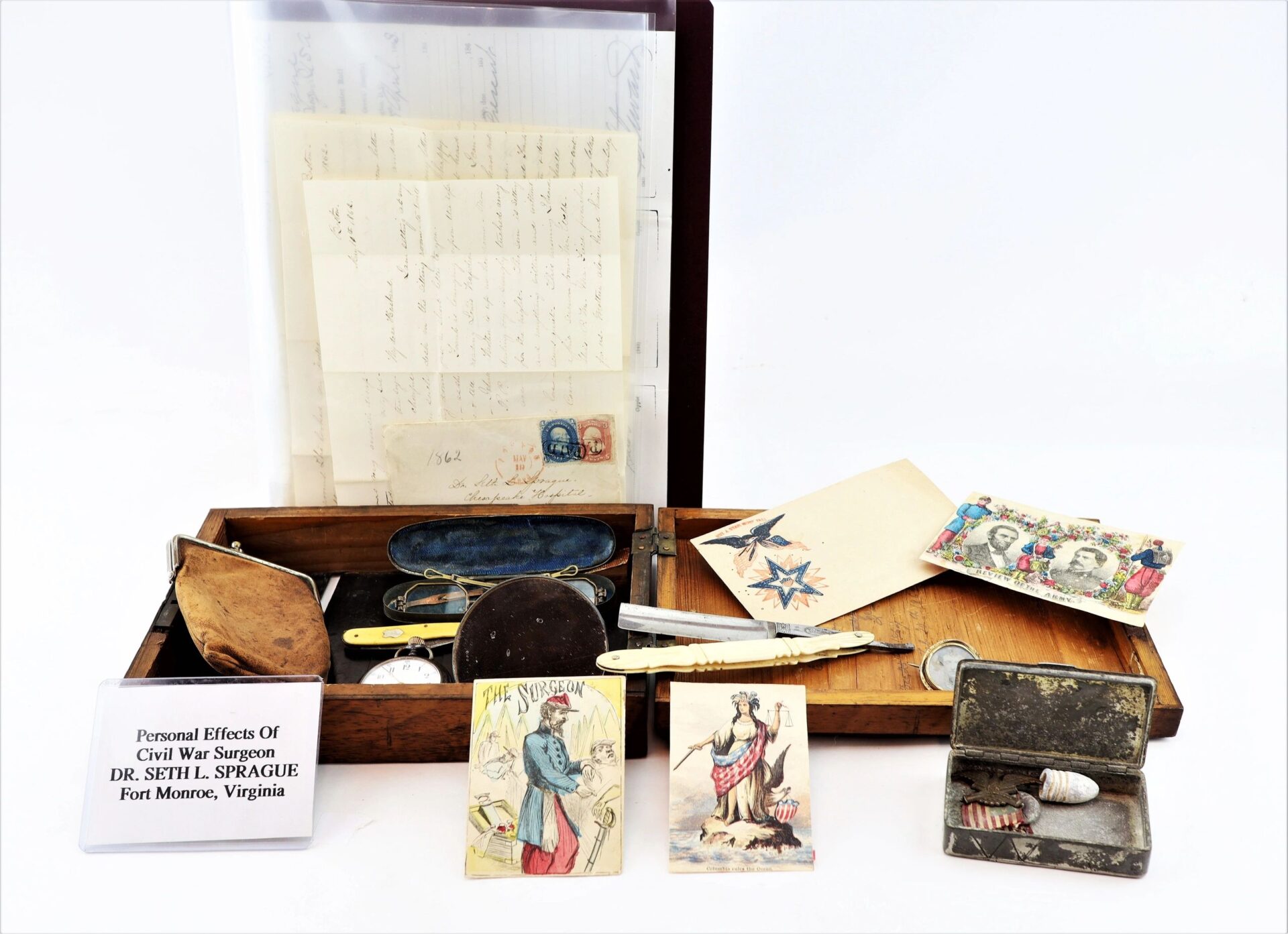 The Personal Effects of Civil War Surgeon Dr. Seth L. Sprague / SOLD include his letters, medical tools, vintage cards, spectacles, coins, and a labeled placard from Fort Monroe, Virginia.