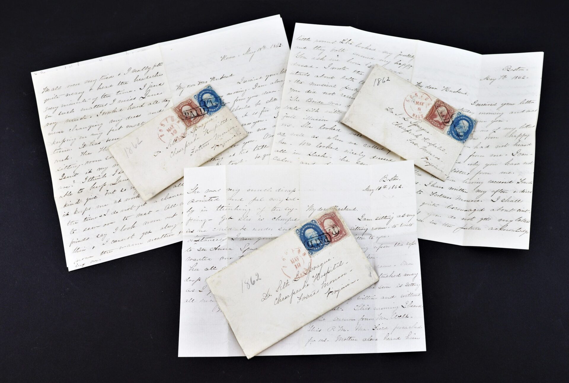 Three handwritten letters from the personal effects of Civil War surgeon Dr. Seth L. Sprague (SOLD) are displayed on a dark background, with vintage envelopes, postage stamps, and partially unfolded pages showing cursive writing.