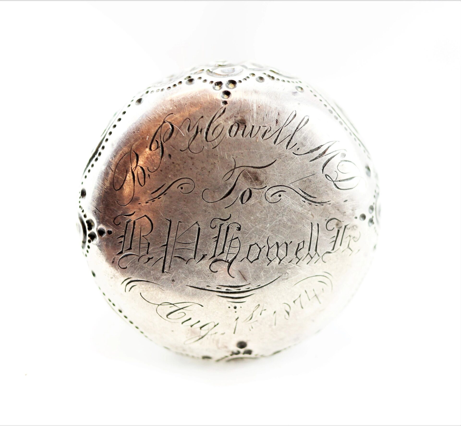 A cane made from a Revolutionary War battleship, engraved with "R. R. Howell M.D. to B. H. Howell Jr. Aug 1st 1879" in decorative script and accented by small dots around the edge.