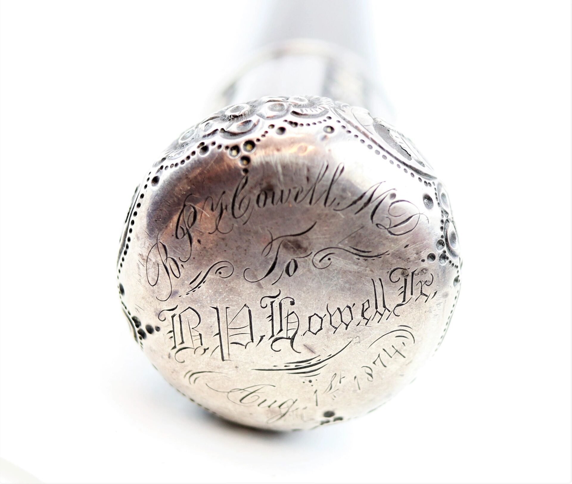 The engraved end of a "Cane Made From Revolutionary War Battleship" is inscribed in cursive: "R. P. Cavell M.D. to B. H. Howell Esq., Aug 17, 1877.