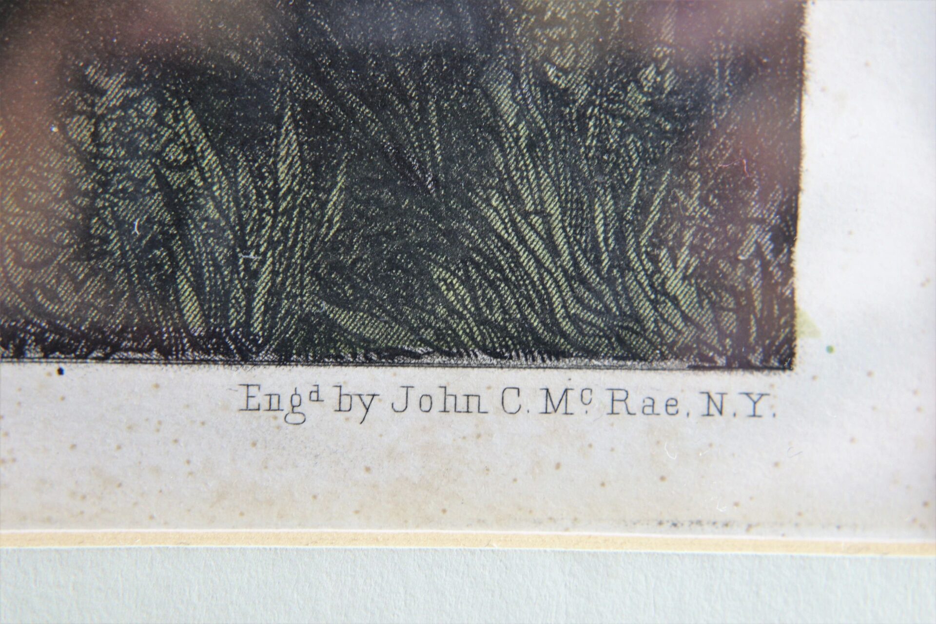 Close-up of "The Surrender of General Lee" print's lower edge, showing the text "Engd by John C. McRae, N.Y." in small serif font.
