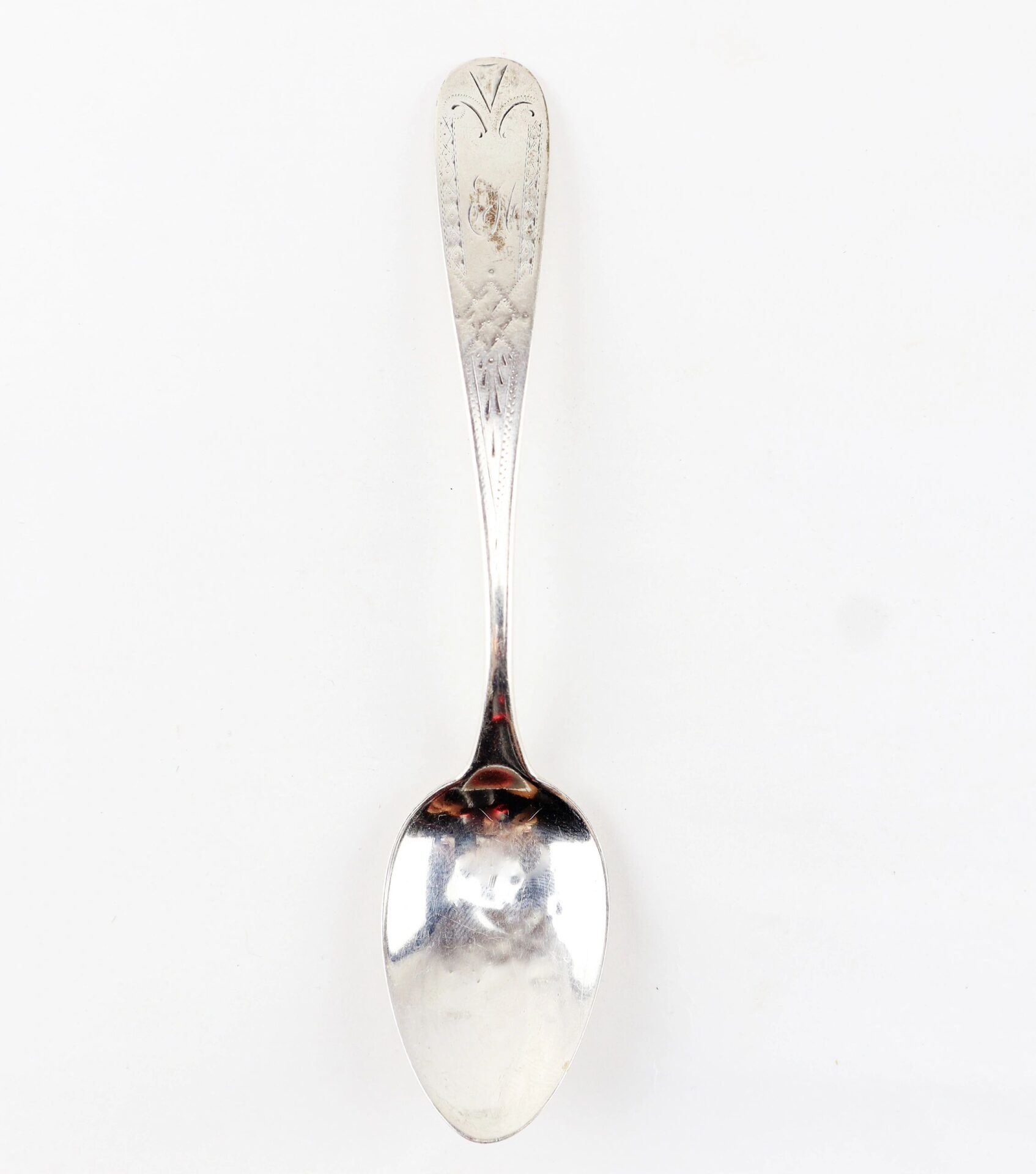 A Civil War silver teaspoon with an ornate, engraved handle is displayed on a plain white background. Product: Civil War Silver Teaspoons / SOLD.