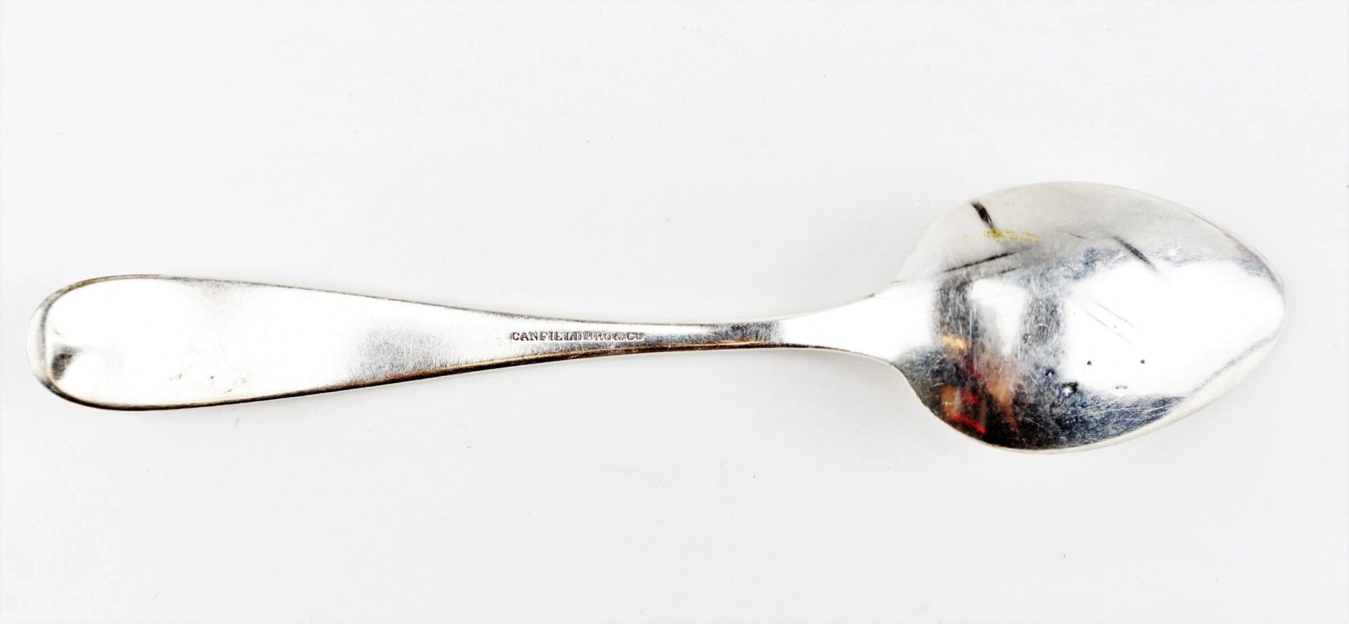 A Civil War Silver Teaspoon with a slightly rounded handle is displayed against a white background. Product Name: Civil War Silver Teaspoons / SOLD.