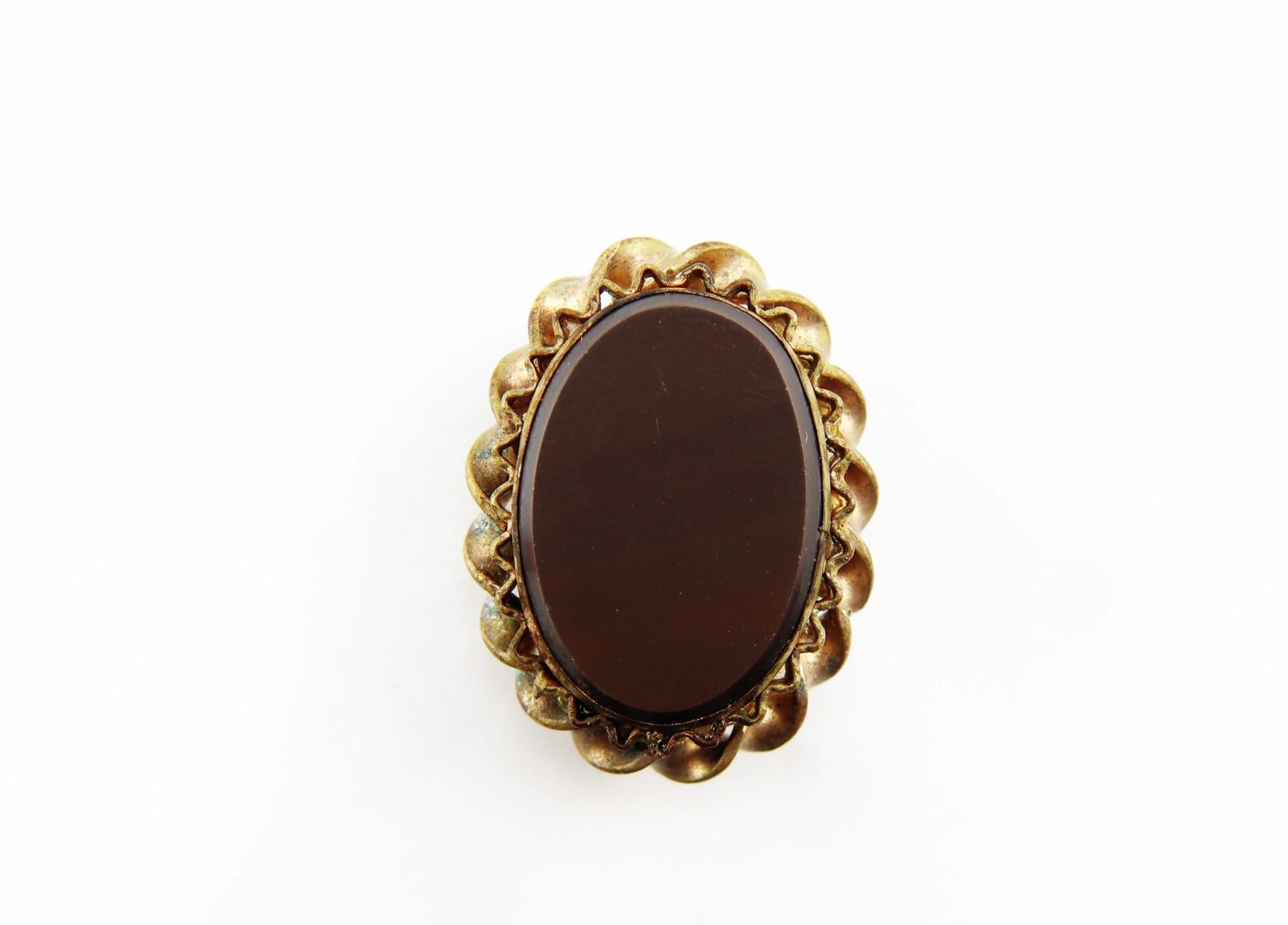 An oval-shaped, dark brown stone brooch titled "Civil War Brooch / SOLD," set in a scalloped gold-tone metal frame, displayed against a white background.