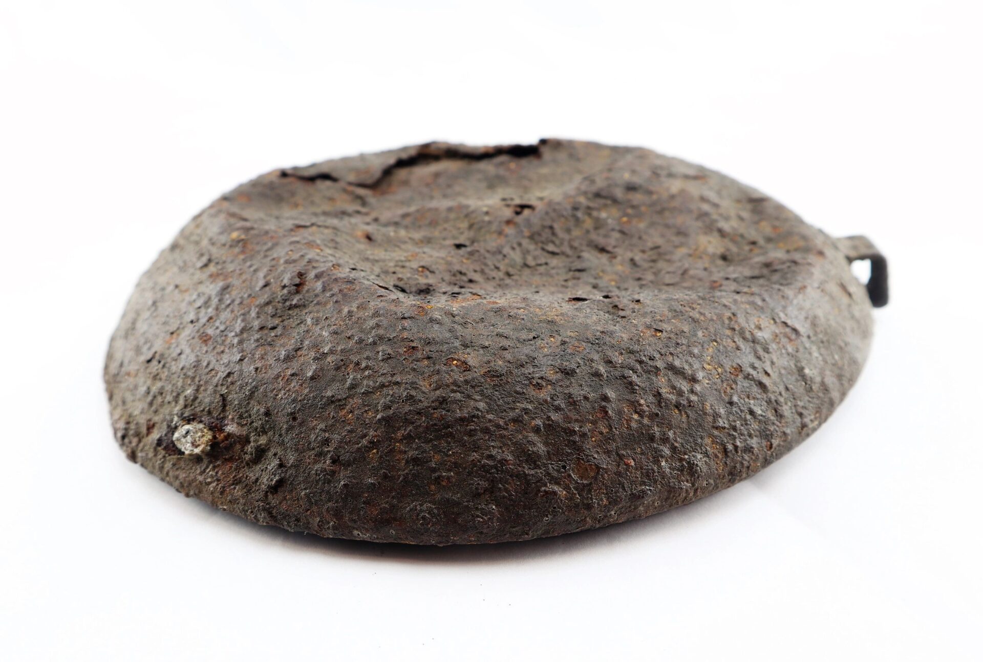 A Battlefield Relic Canteen, featuring a rusty, dented, rounded and flattened metal body, is photographed on a white background.