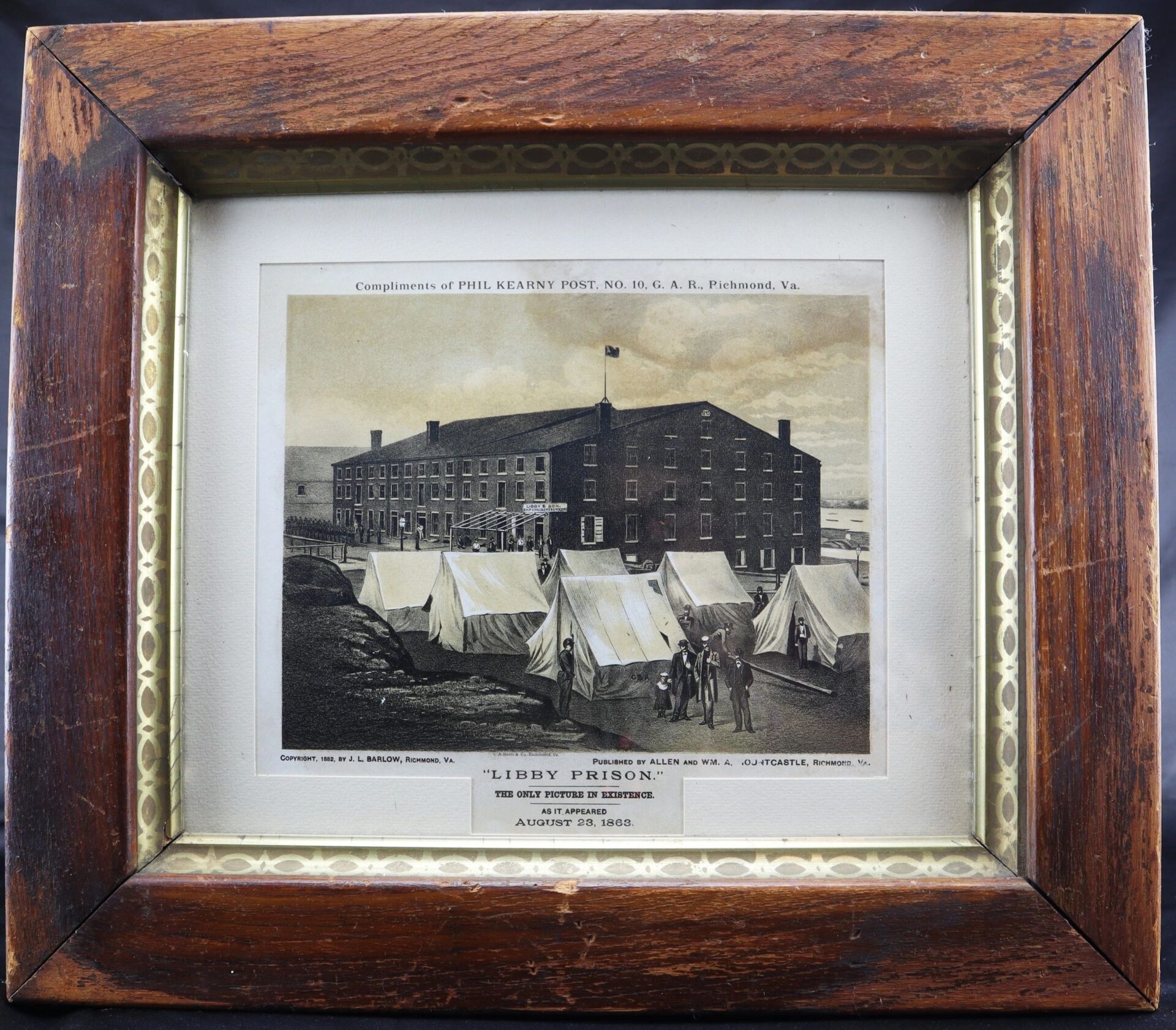 Framed illustration titled "Libby Prison / Sold," shows Libby Prison with tents out front, labeled as “The Only Picture Extant,” dated August 23, 1863, with historical and authorship details above the image.