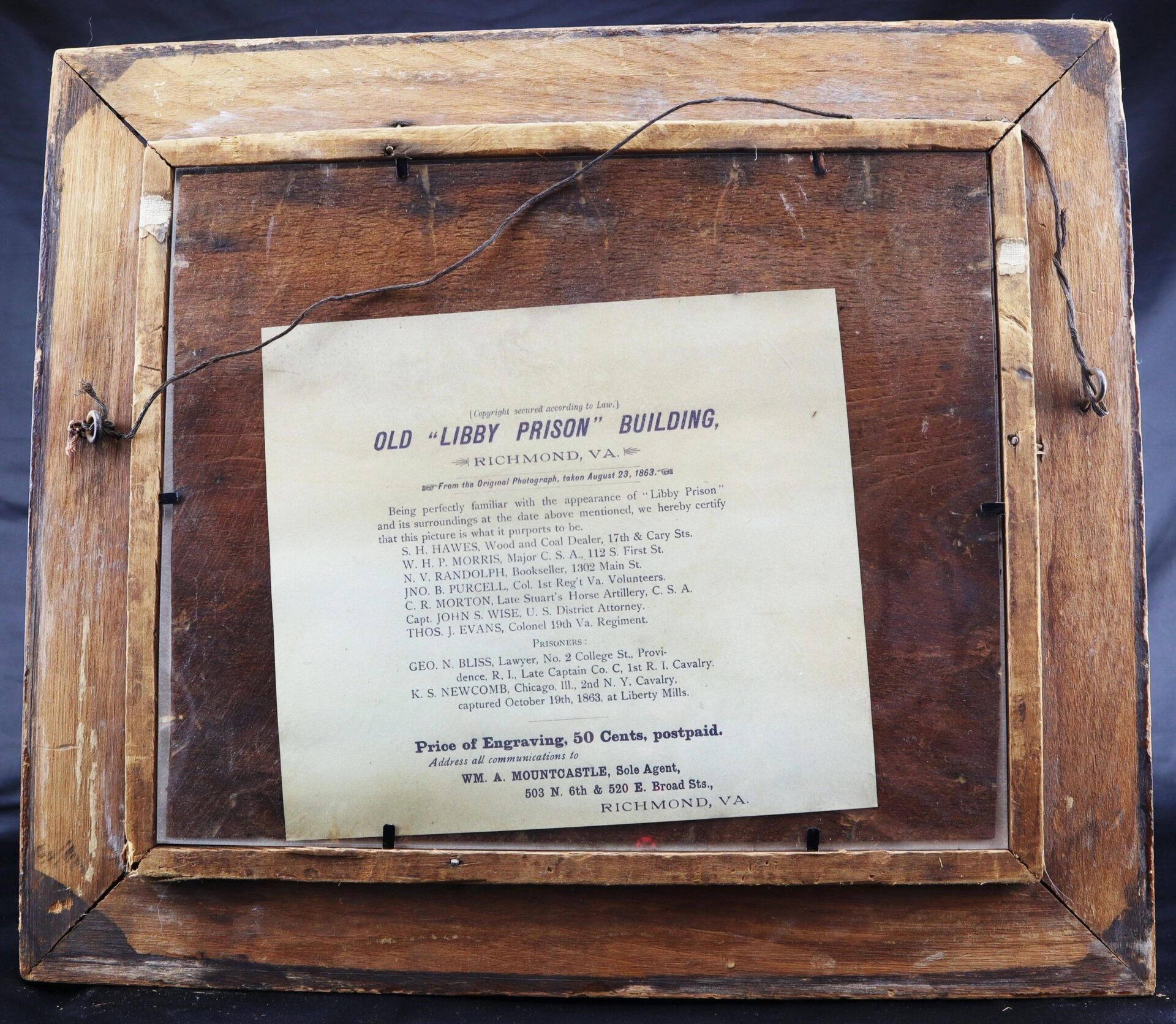 The back of "Libby Prison / Sold" features a mounted informational paper detailing the history and engravings of the Old Libby Prison building in Richmond, Virginia.