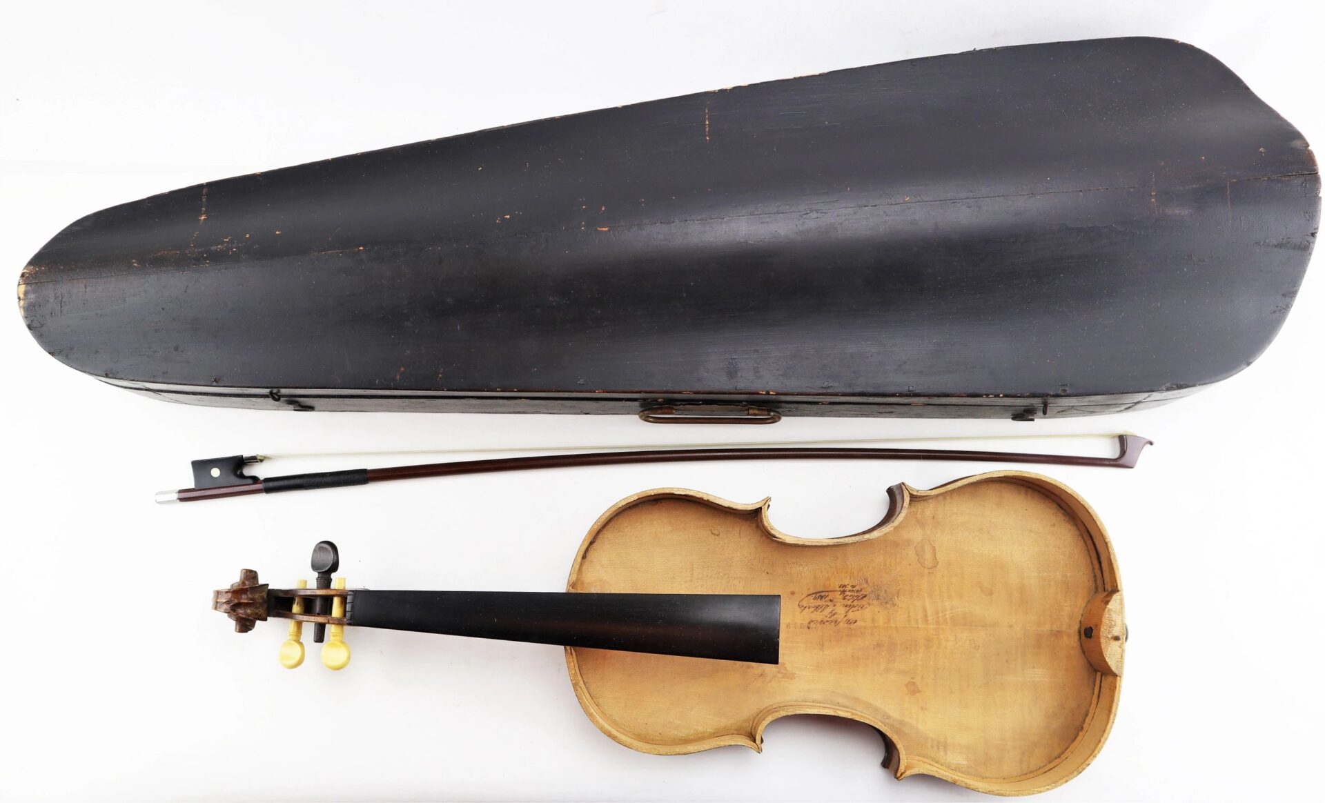 Violin / Sold: Displayed with bow and closed case on a white surface. Violin shows wear and is missing strings; case has visible scratches.