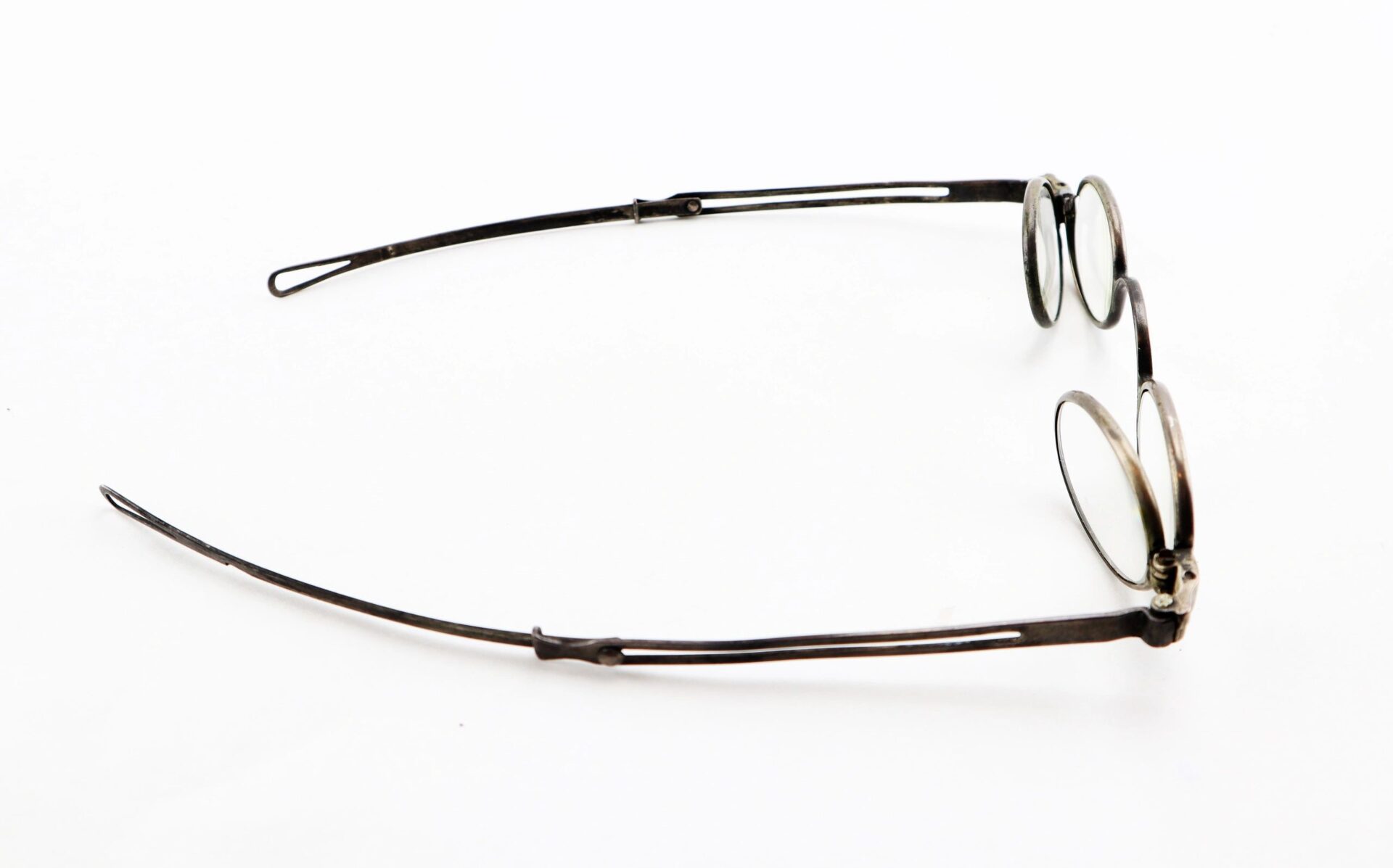 A pair of Civil War Eyeglasses with round lenses and thin metal frames, laid flat on a white background. Marked as SOLD.