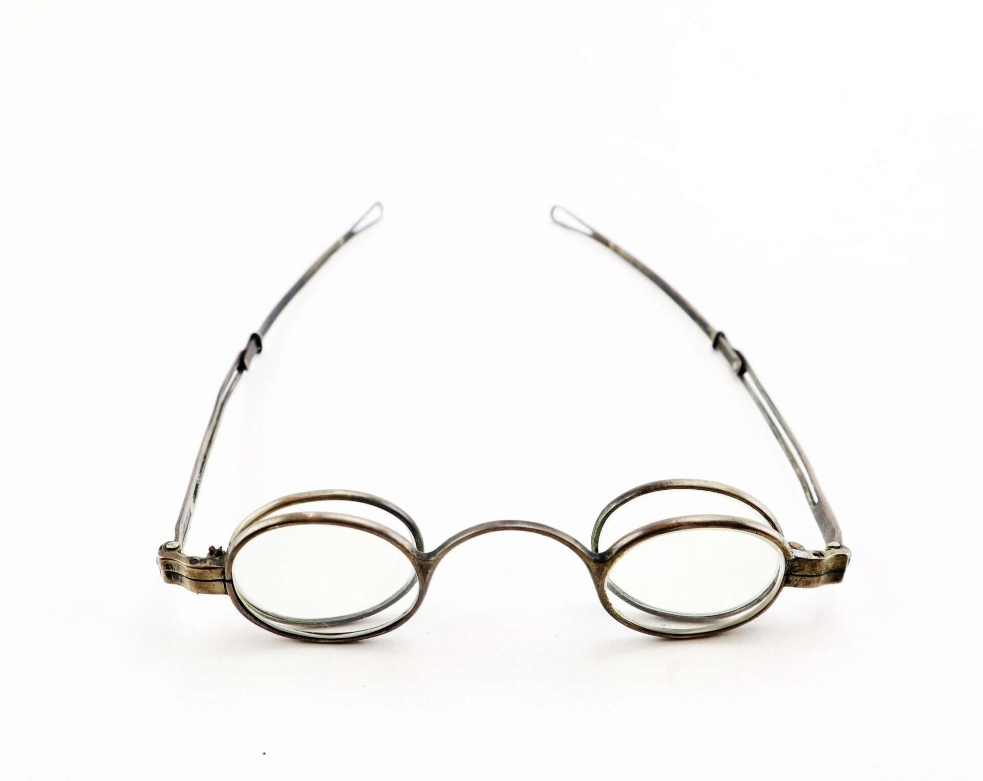A pair of vintage Civil War Eyeglasses with oval wire-rimmed lenses and thin metal arms is displayed on a white background.