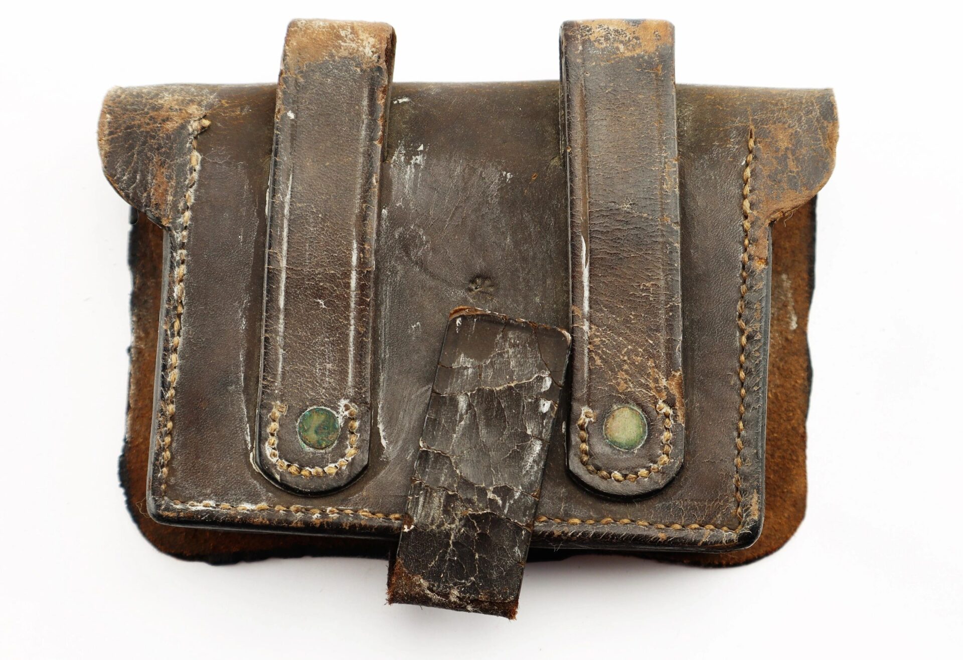 A Civil War Pistol Cartridge Box in brown leather, featuring two belt loops and a flap strap, displays visible aging and weathering.