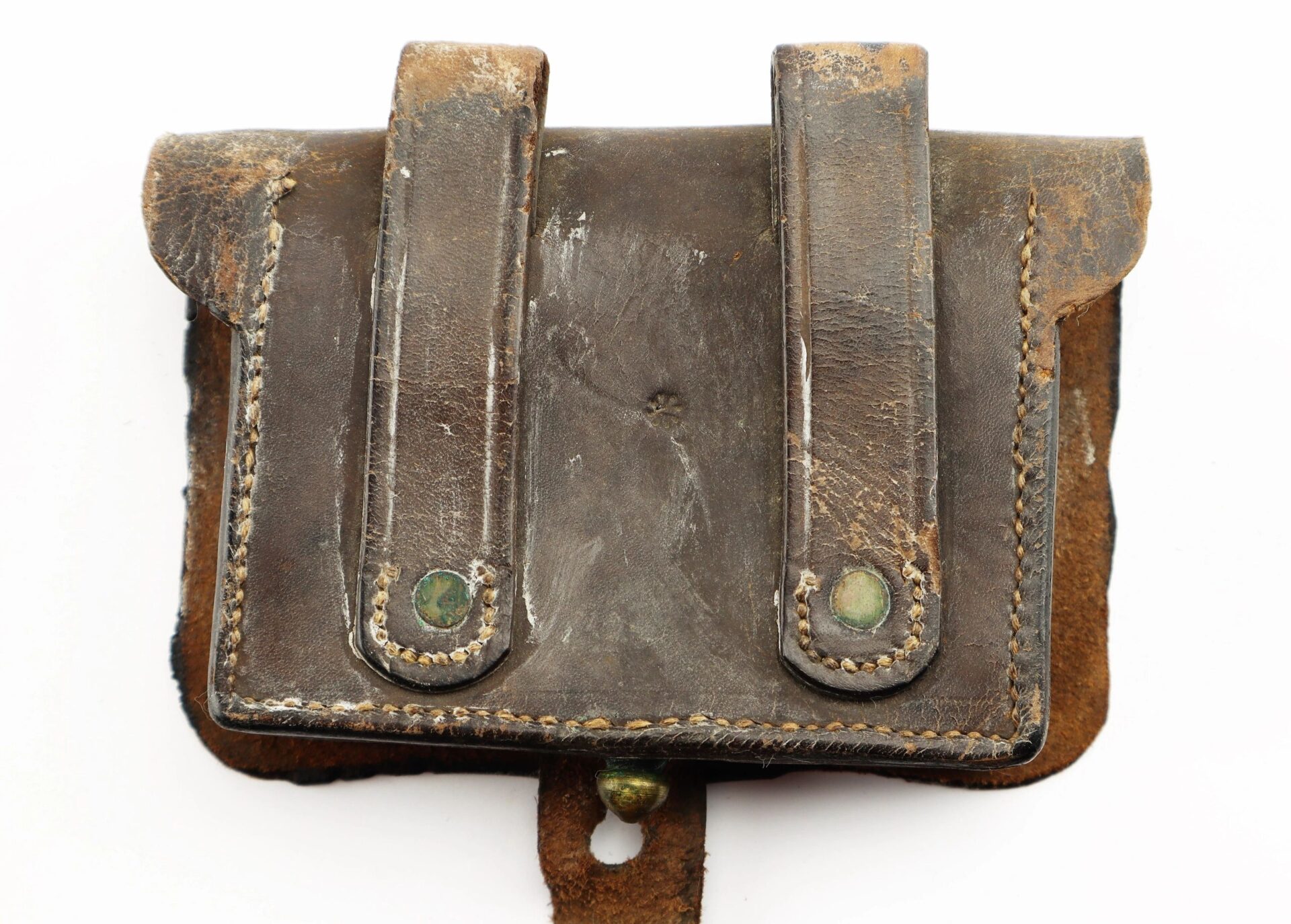A Civil War Pistol Cartridge Box, sold, crafted from worn brown leather with two straps and visible stitching, showing signs of age and use.