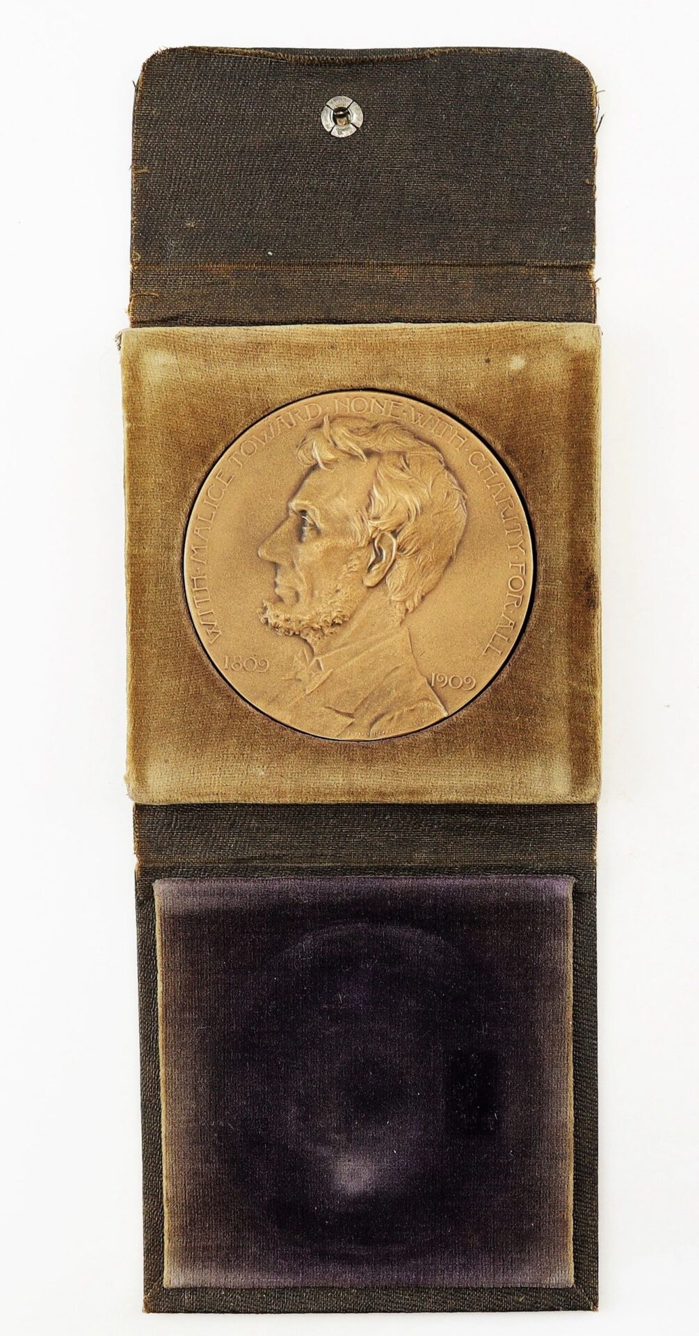 An Abraham Lincoln Centennial Medal, sold in a vintage velvet-lined display case.