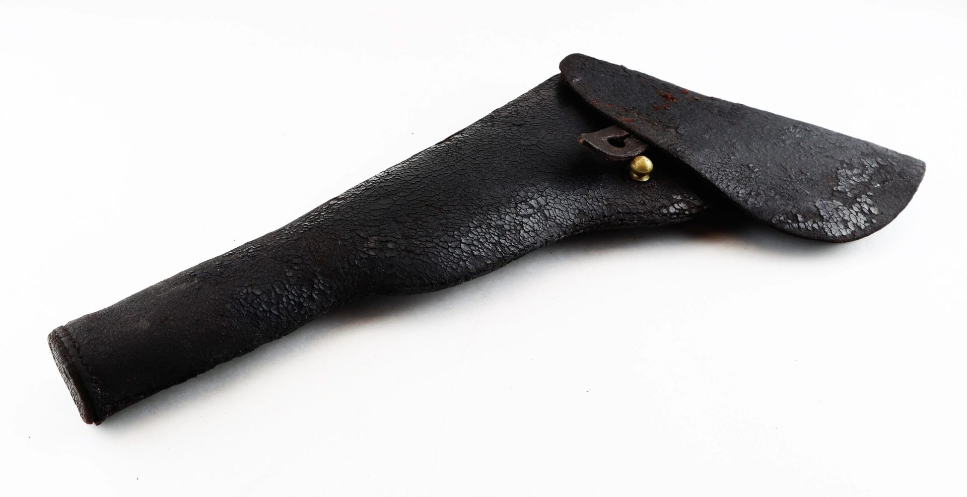 A black, worn Colt Dragoon Holster with a flap cover and brass button closure is displayed on a white background.