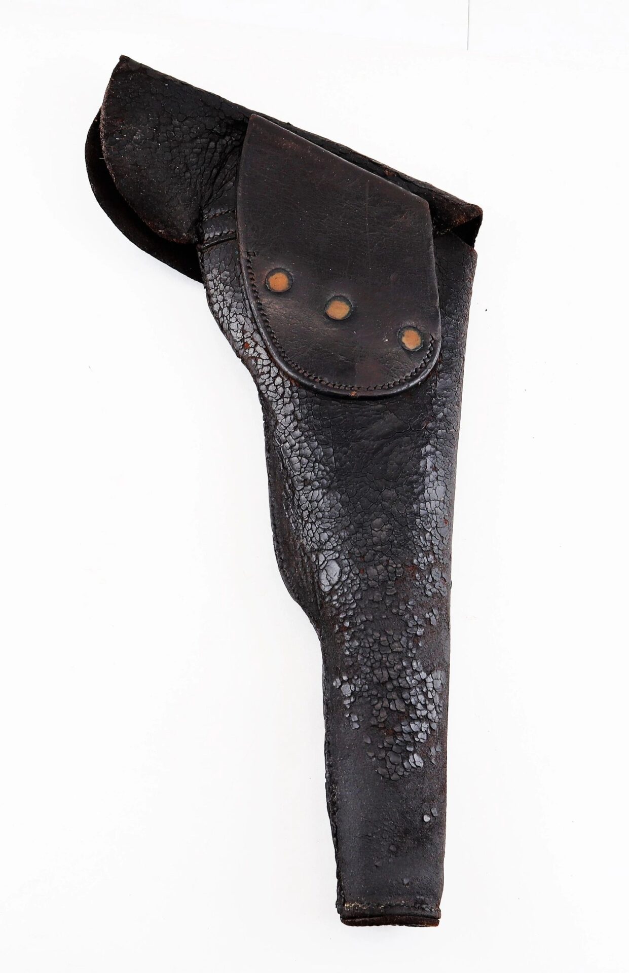A worn, black Colt Dragoon Holster with a flap secured by three metal rivets, displayed against a white background. Item is SOLD.