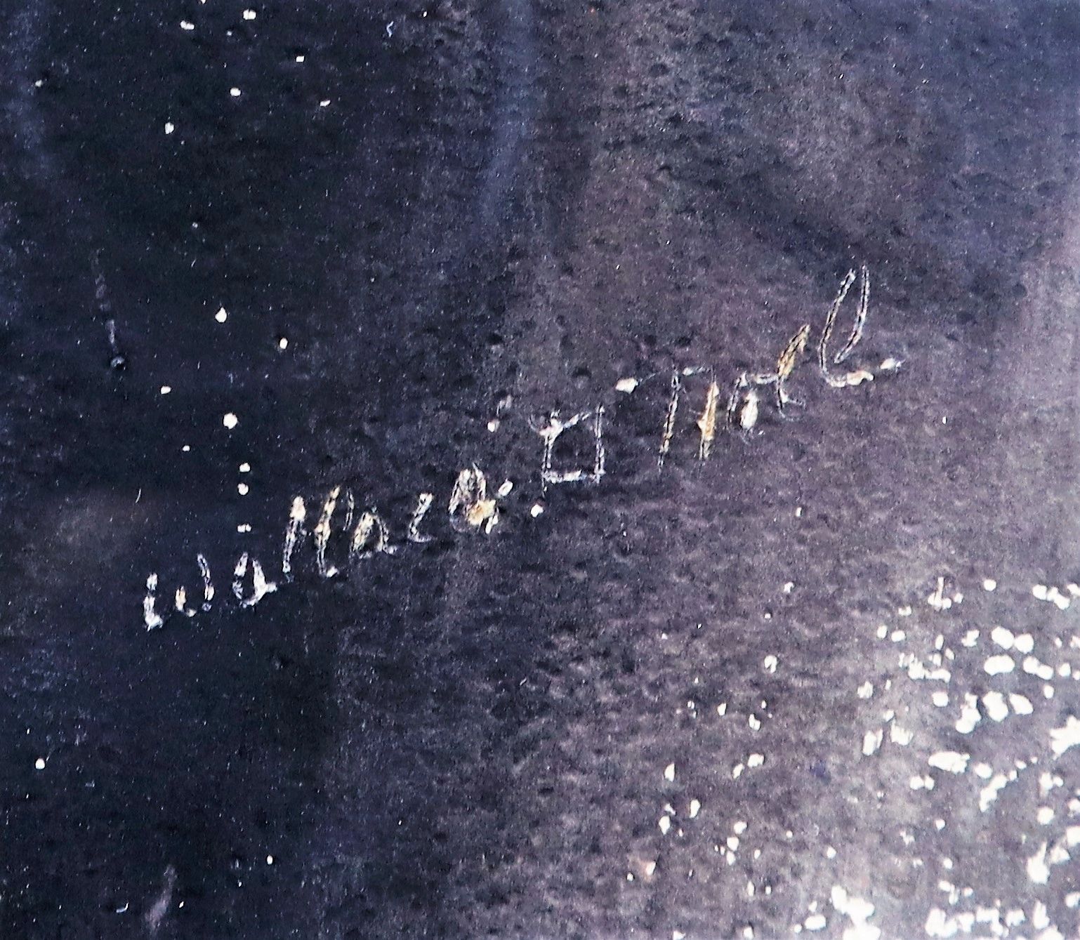 Handwritten text on a dark, speckled surface reads "Beardless” Abraham Lincoln in cursive.