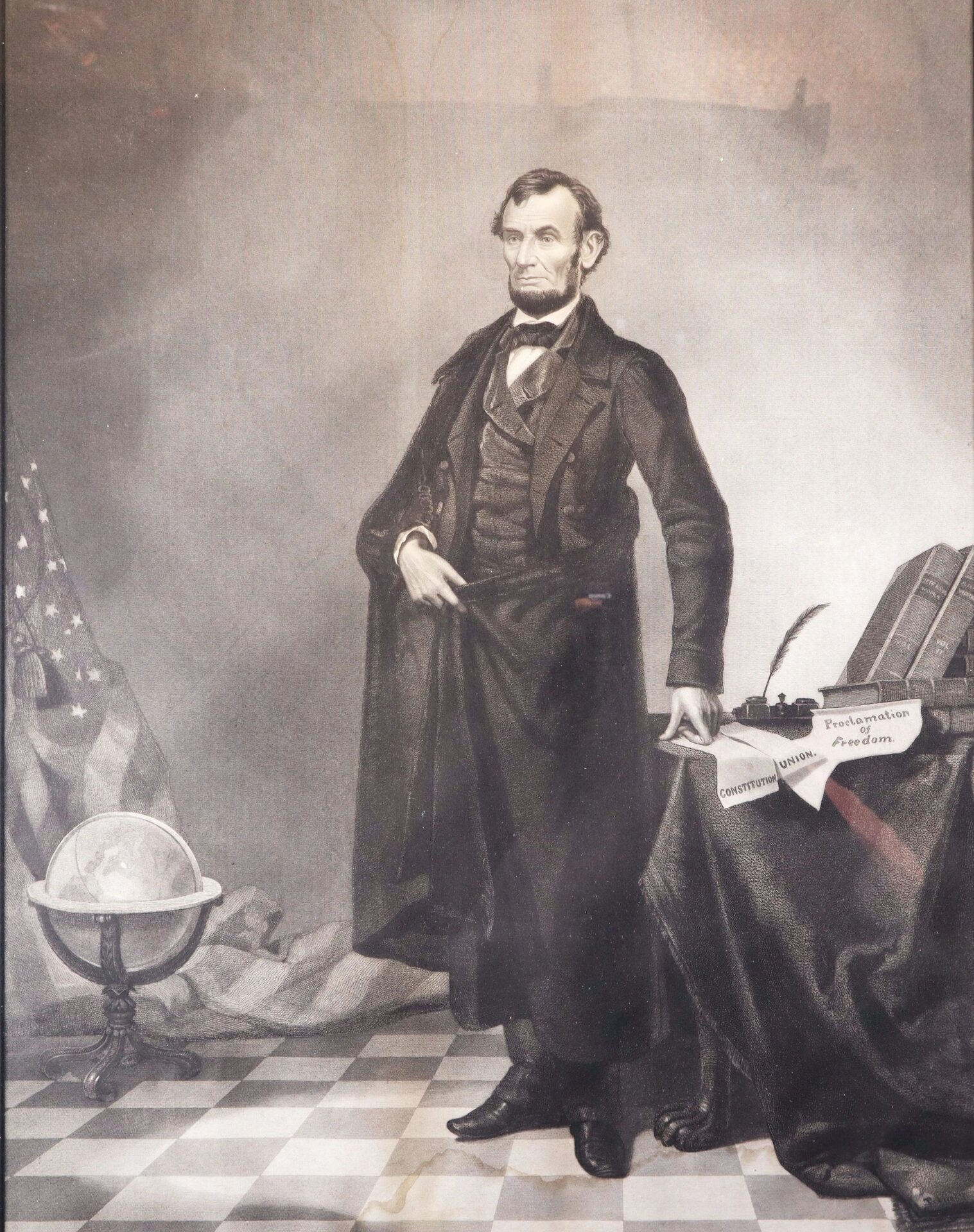 A man in 19th-century attire, representing Abraham Lincoln (SOLD), stands with one hand in his coat by a table holding books, a quill, and papers titled "Constitution," "Pennsylvania," and "Freedom," with an American flag and globe nearby.