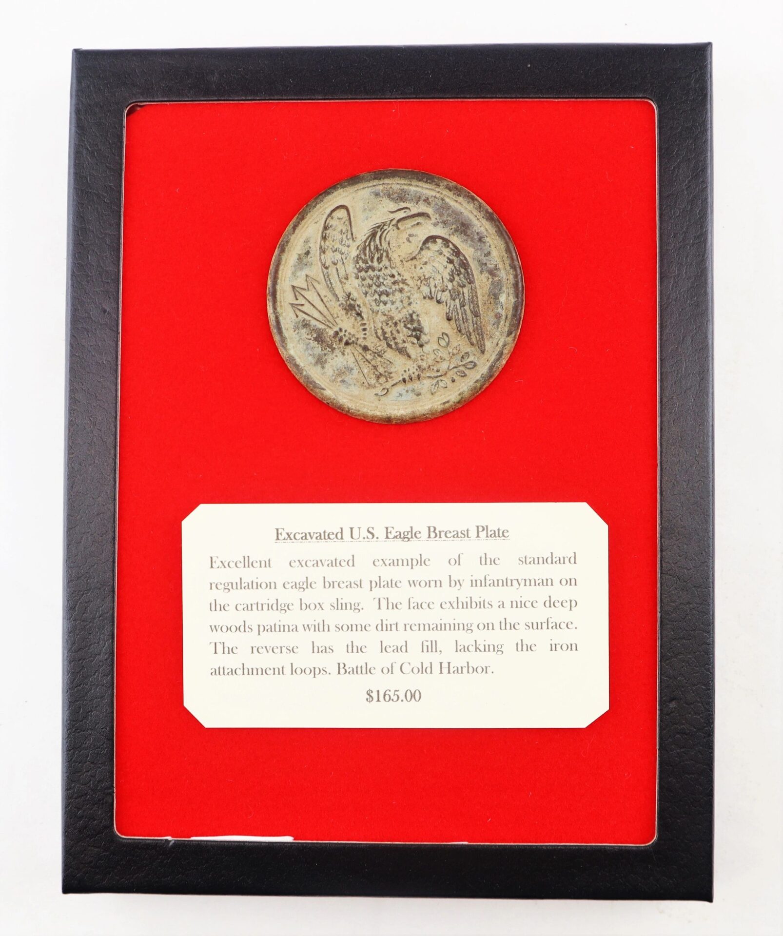 Framed display of Excavated U.S. Eagle Breast Plate / SOLD with descriptive text, showing a weathered eagle emblem on red background; price: $165.
