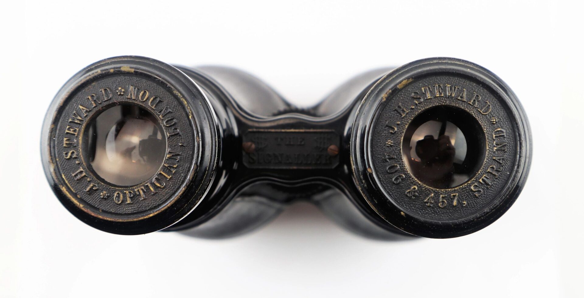 Close-up view of the eyepieces on Civil War Field Glasses and Case, vintage black binoculars marked "J. H. Steward Ltd. London 457. Strand." / SOLD.