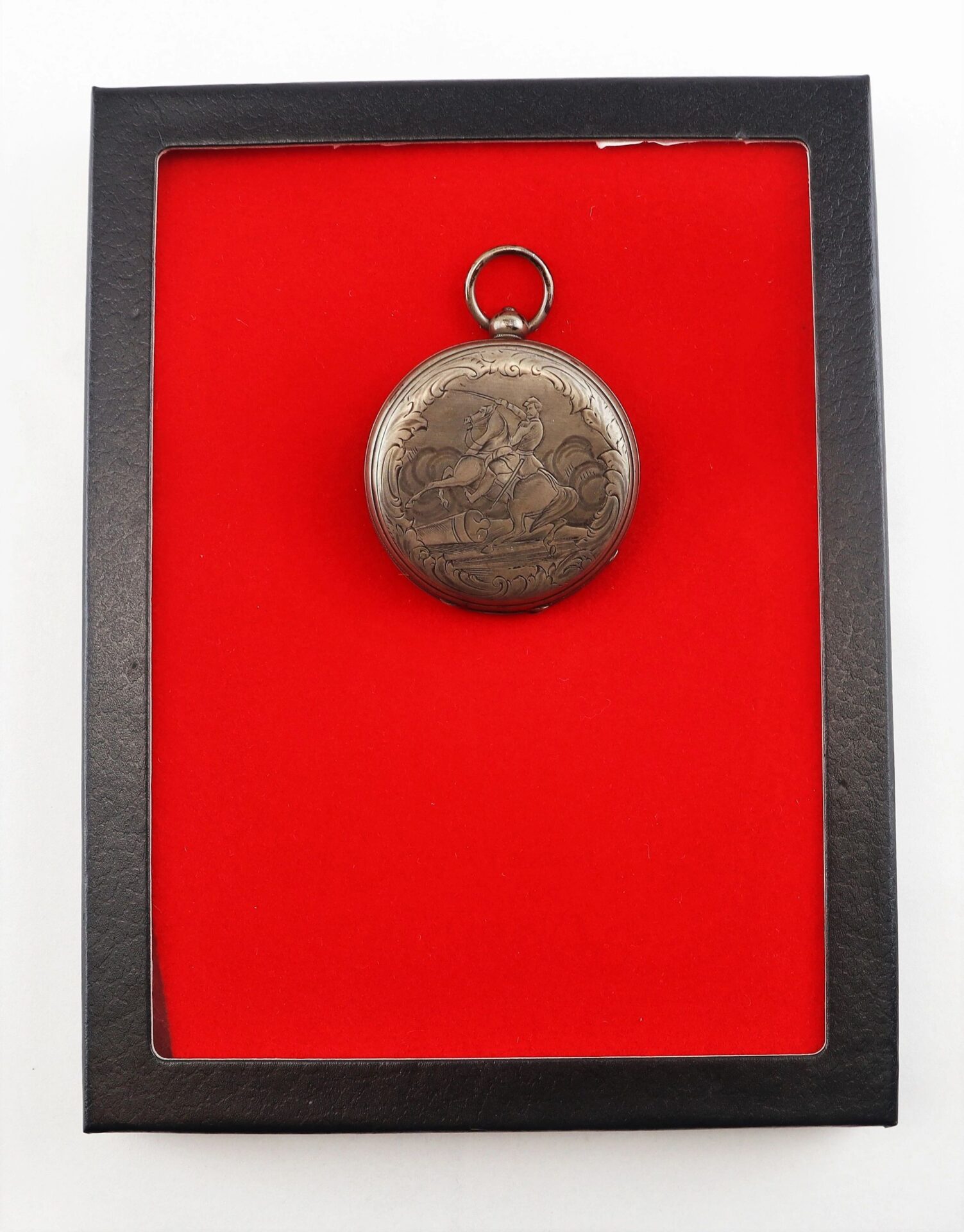 A Silver Pocket Watch with Civil War Engraving, now SOLD, is displayed in a black frame against a red background.