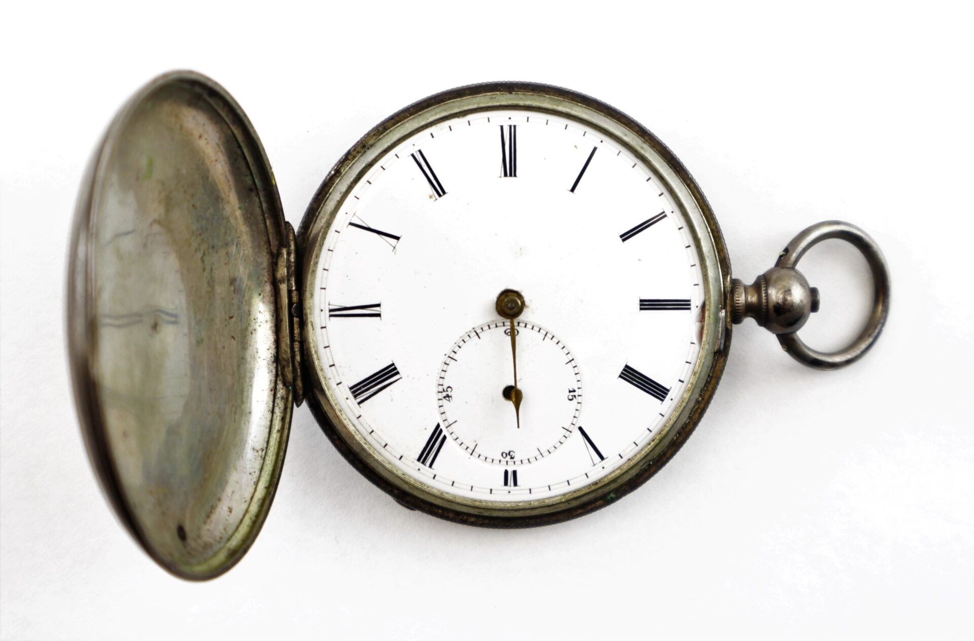 A Silver Pocket Watch with Civil War Engraving, open cover, features Roman numerals and a small seconds subdial set on a white background. / SOLD.