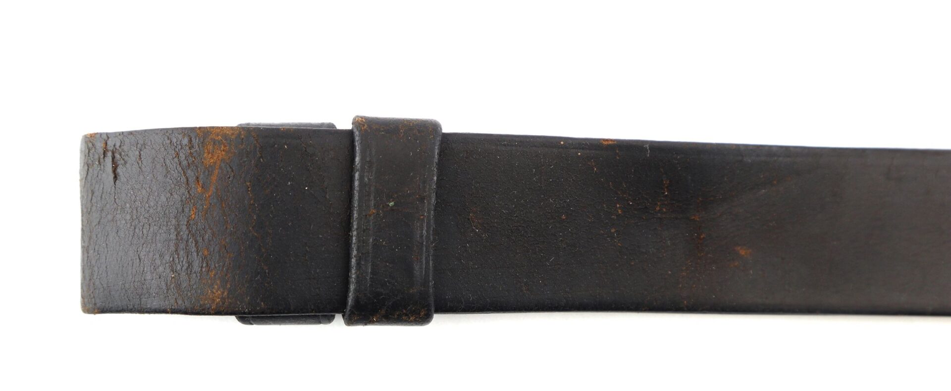 A close-up view of a worn Civil War Musket Sling with visible creases and some brown discoloration.