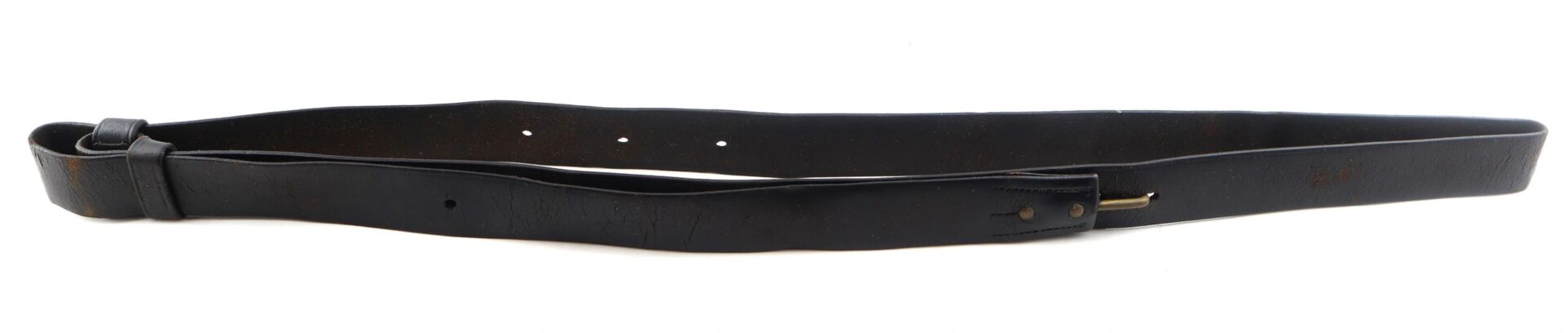 A Civil War musket sling, black leather with a brass buckle and multiple adjustment holes, is laid out flat on a white background.