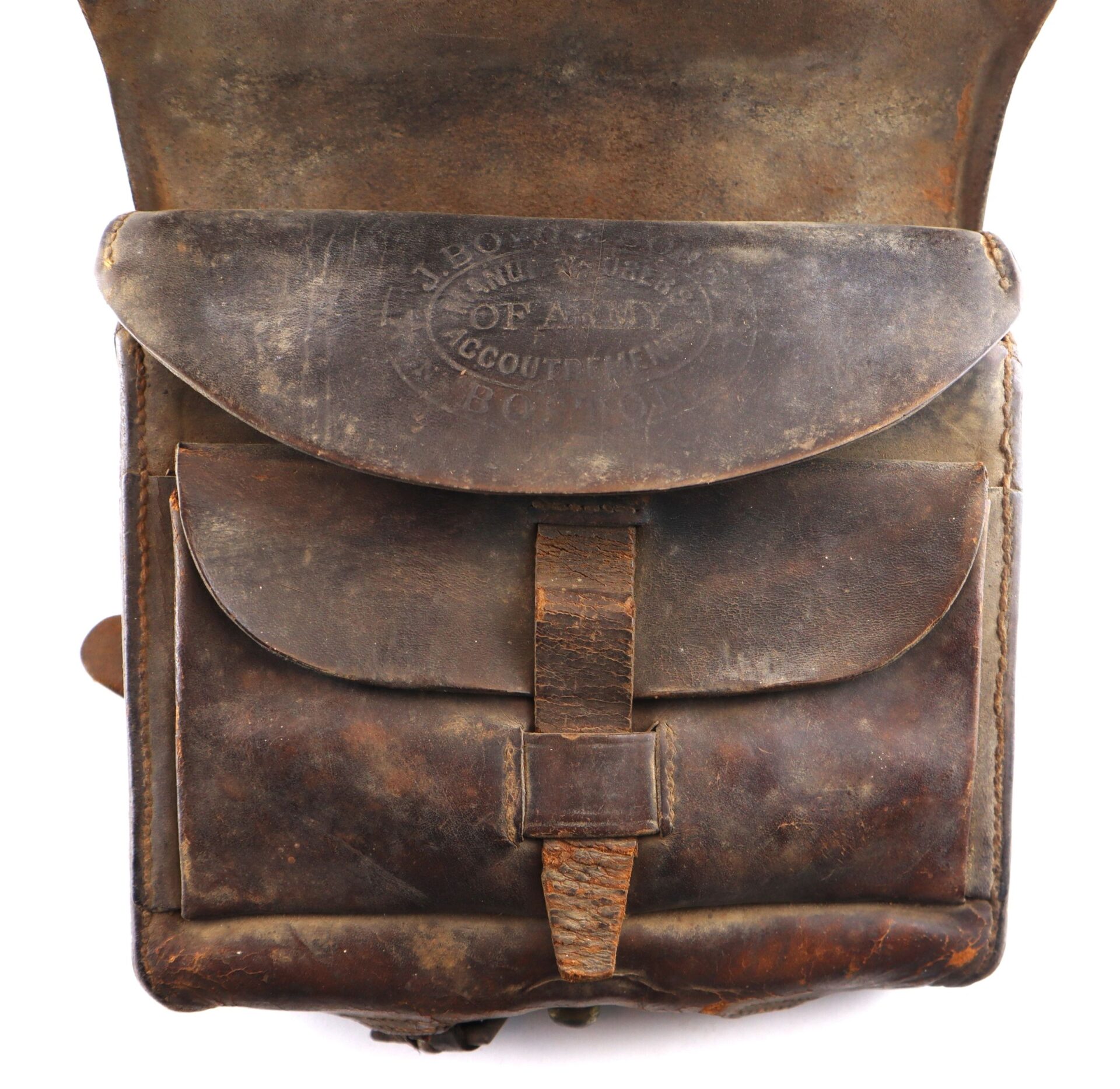 A worn brown leather Complete Cartridge Box with a flap closure and an embossed "U.S. Army Accoutrement Depot" stamp.
