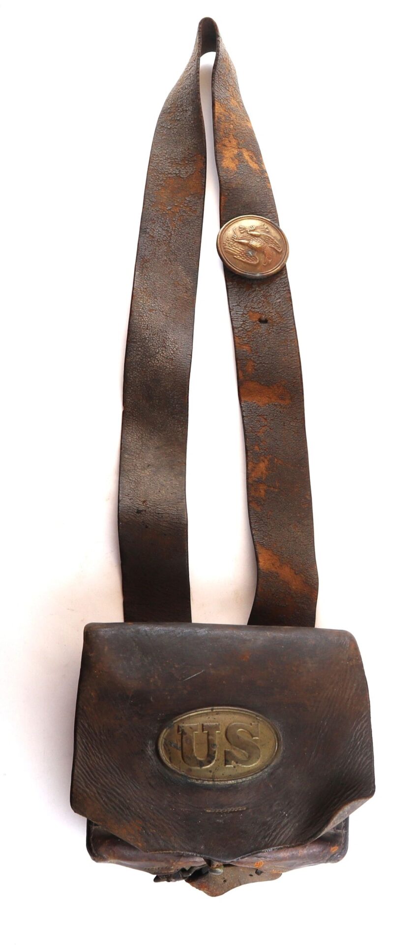 Complete Cartridge Box with worn leather, shoulder strap, and brass "US" emblem—likely a historical military cartridge bag.